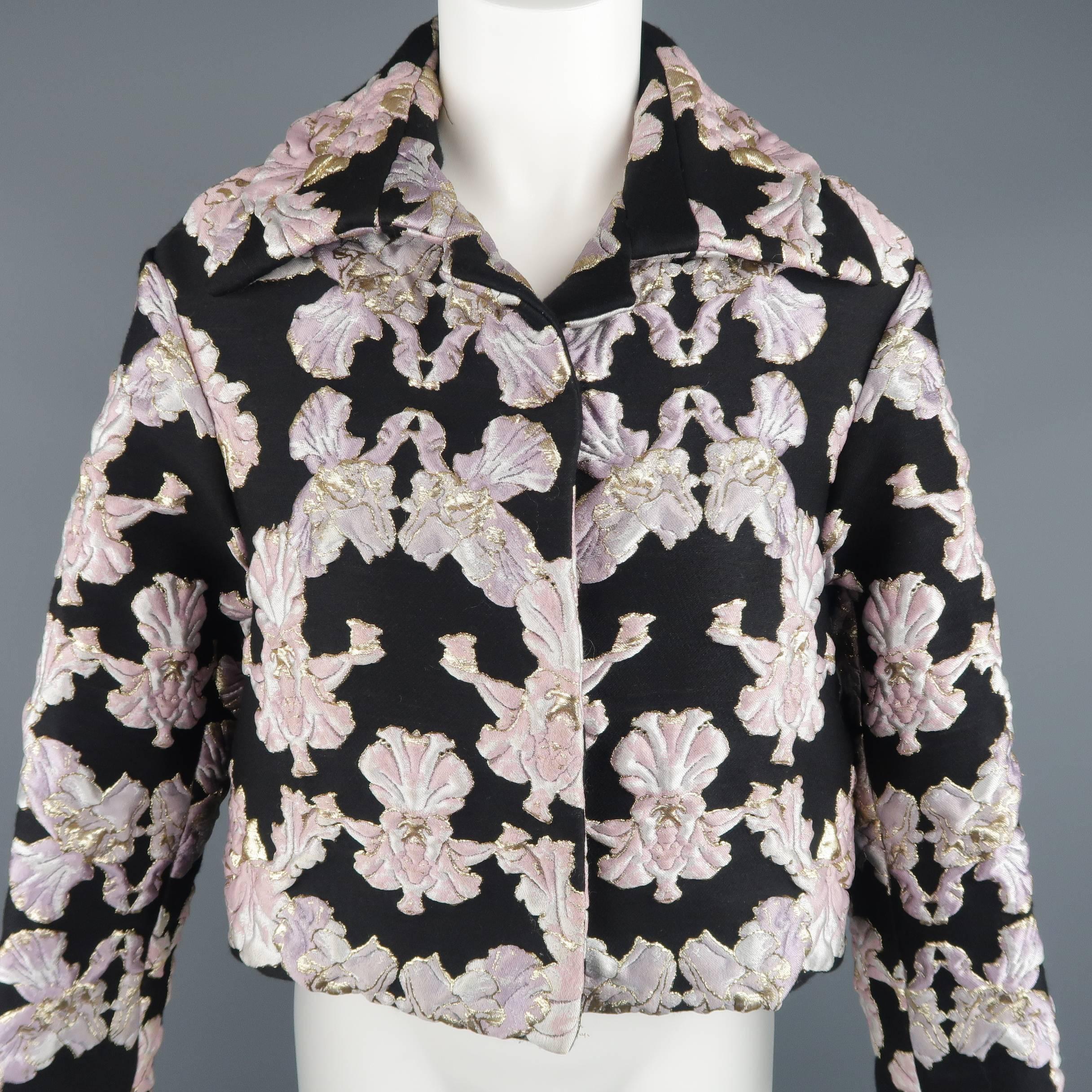 FRANCESCO SCOGNAMIGLIO cropped jacket comes in a structured black and pink textured brocade fabric with metallic gold, symmetrical orchid print throughout and features a wide spread collar, hidden snap closure, and oversized silhouette. Spring 2016