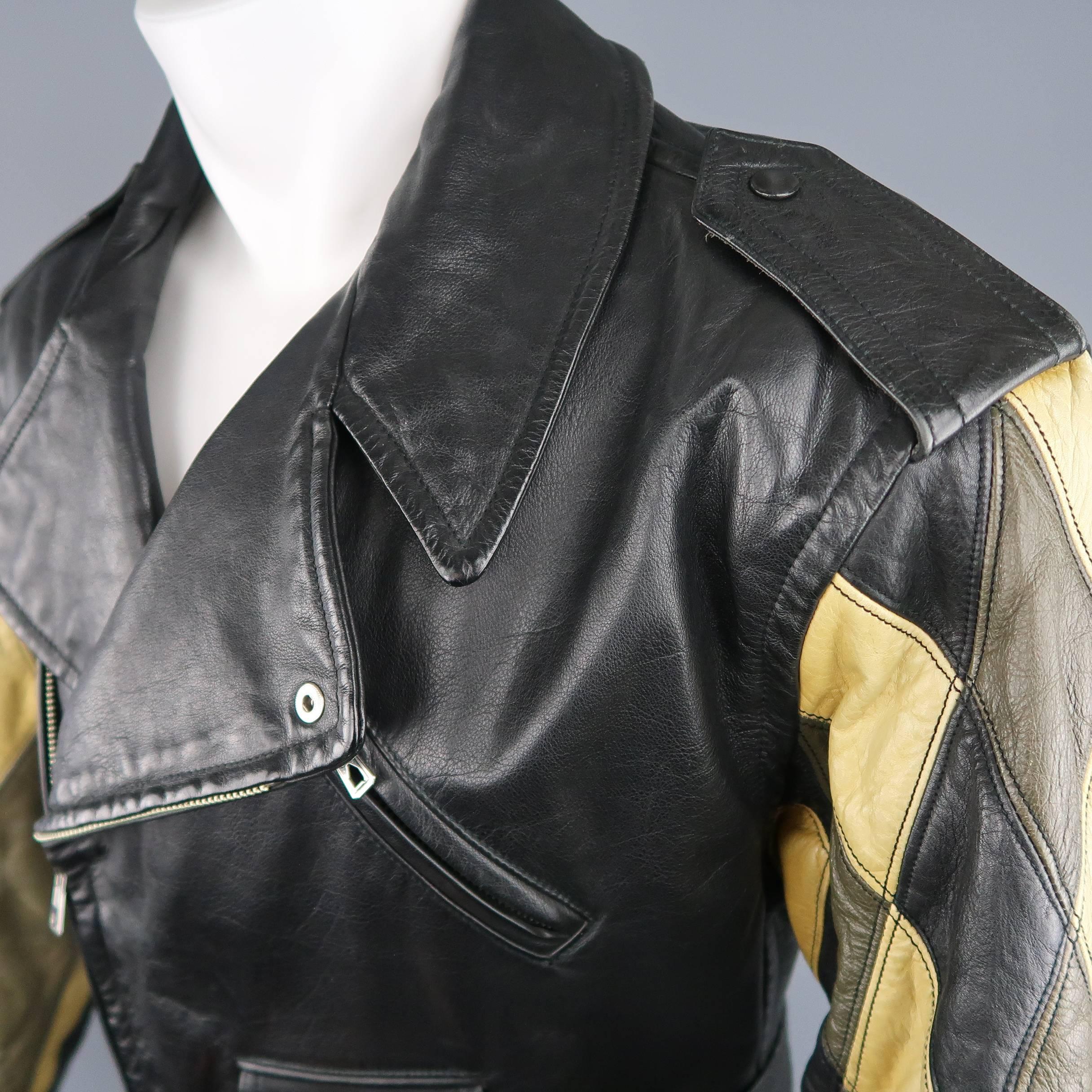 Vintage 1980's JEAN PAUL GAULTIER motorcycle style jacket comes in black structured leather and features a pointed collar lapel, asymmetrical zip closure, belted waist, zip pockets, signature back tab, and olive green and beige patchwork diamond