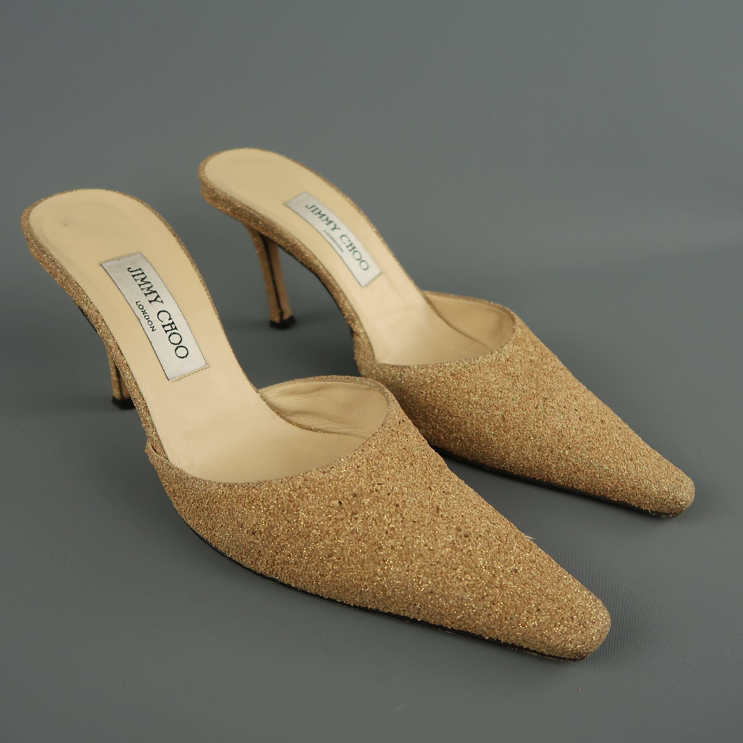 JIMMY CHOO mules come in a unique textured cork glitter leather with a pointed toe and covered stiletto heel. Made in Italy.
 
Good Pre-Owned Condition.
Marked: IT 40
 
Heel: 3.75 in.

SKU: 87050
