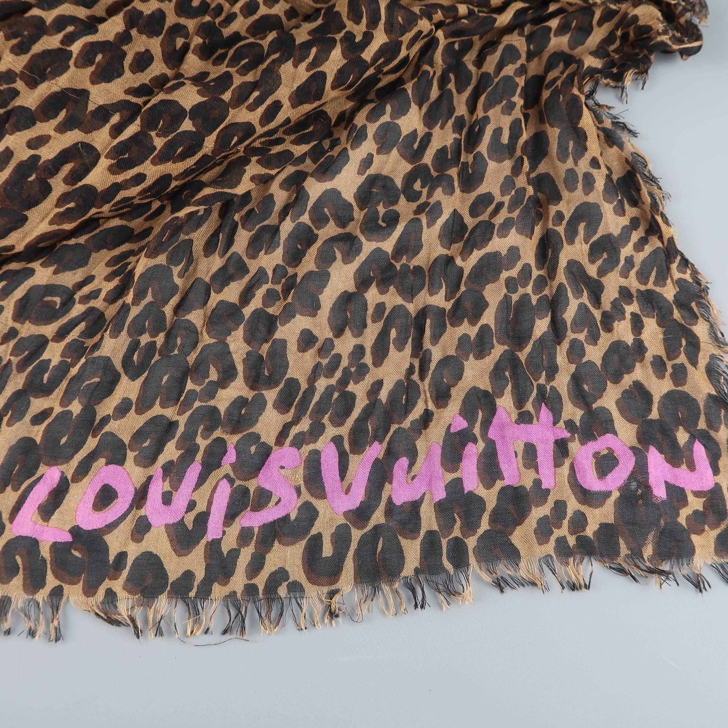Rare and coveted LOUIS VUITTON x STEPHEN SPROUSE collaboration scarf comes in a cashmere silk blend light weight gauze material with all over leopard print, fringed edges, and pink graffiti logo. Minor runs throughout. As-Is. includes original dust