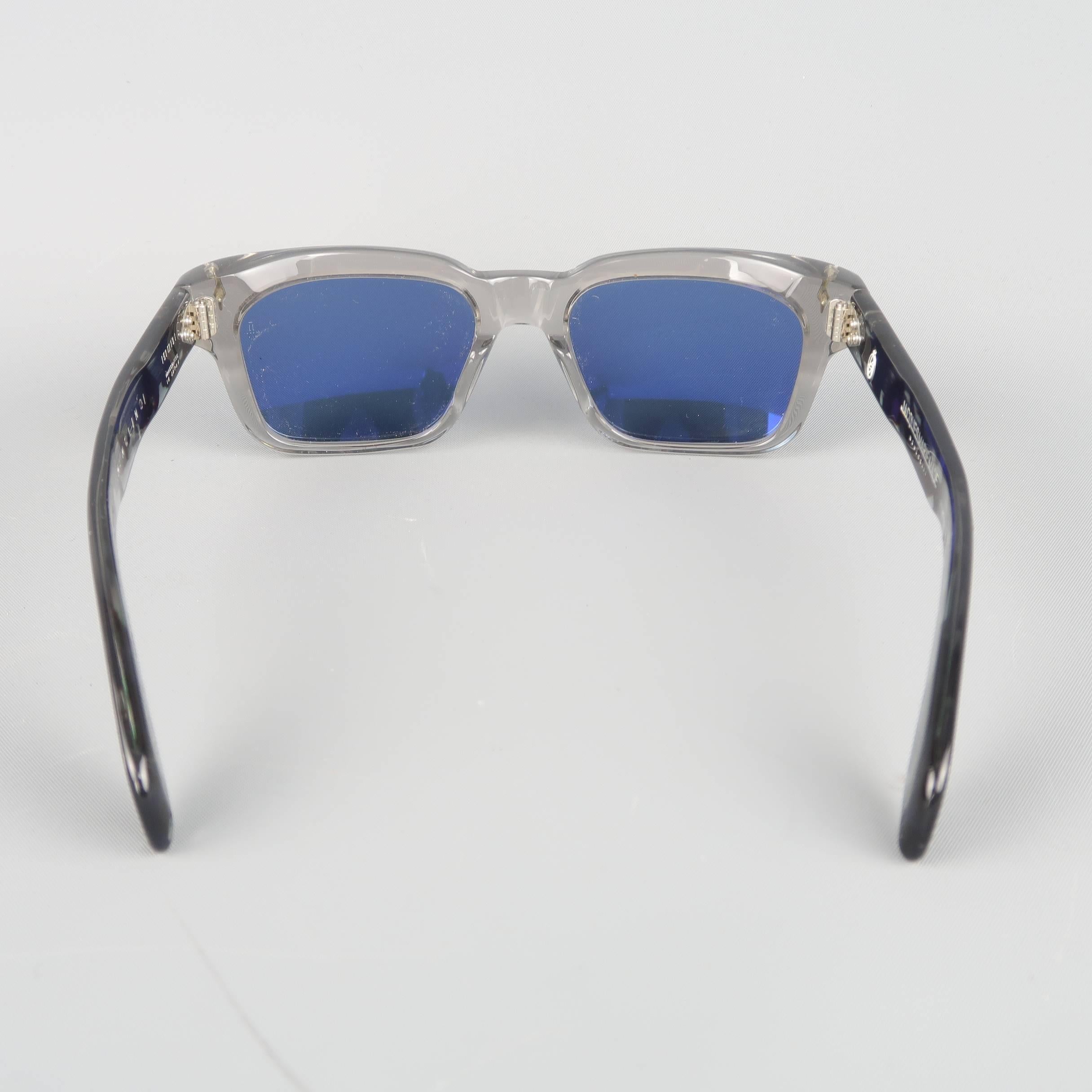 JACQUES MARIE MAGE wayfarer style sunglasses features a clear gray front with blue tone lenses and blue shell–colored acetate arms. With Case and box. Handcrafted  in Japan.
 
Good Pre-Owned-Condition.
Marked: JMMNL 1 6   (No.65 of 250)
 
Width: