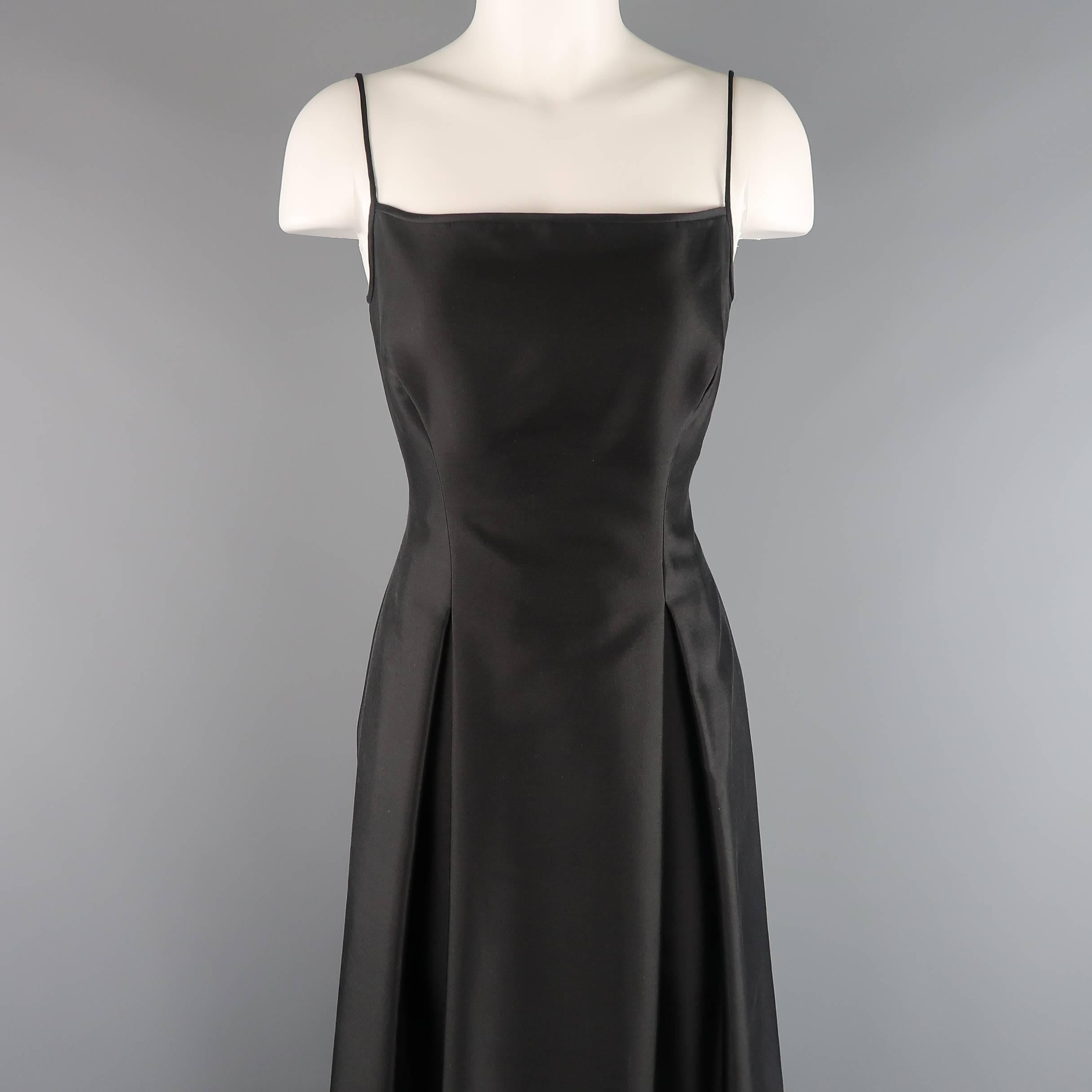 PAMELA DENNIS COUTURE gown comes in a wool silk structured satin and features a square neckline, spaghetti straps, and full A line skirt with box pleat details. Minor wear on train. As-Is.
 
Good Pre-Owned Condition.
Marked: 6
 
Measurements:
