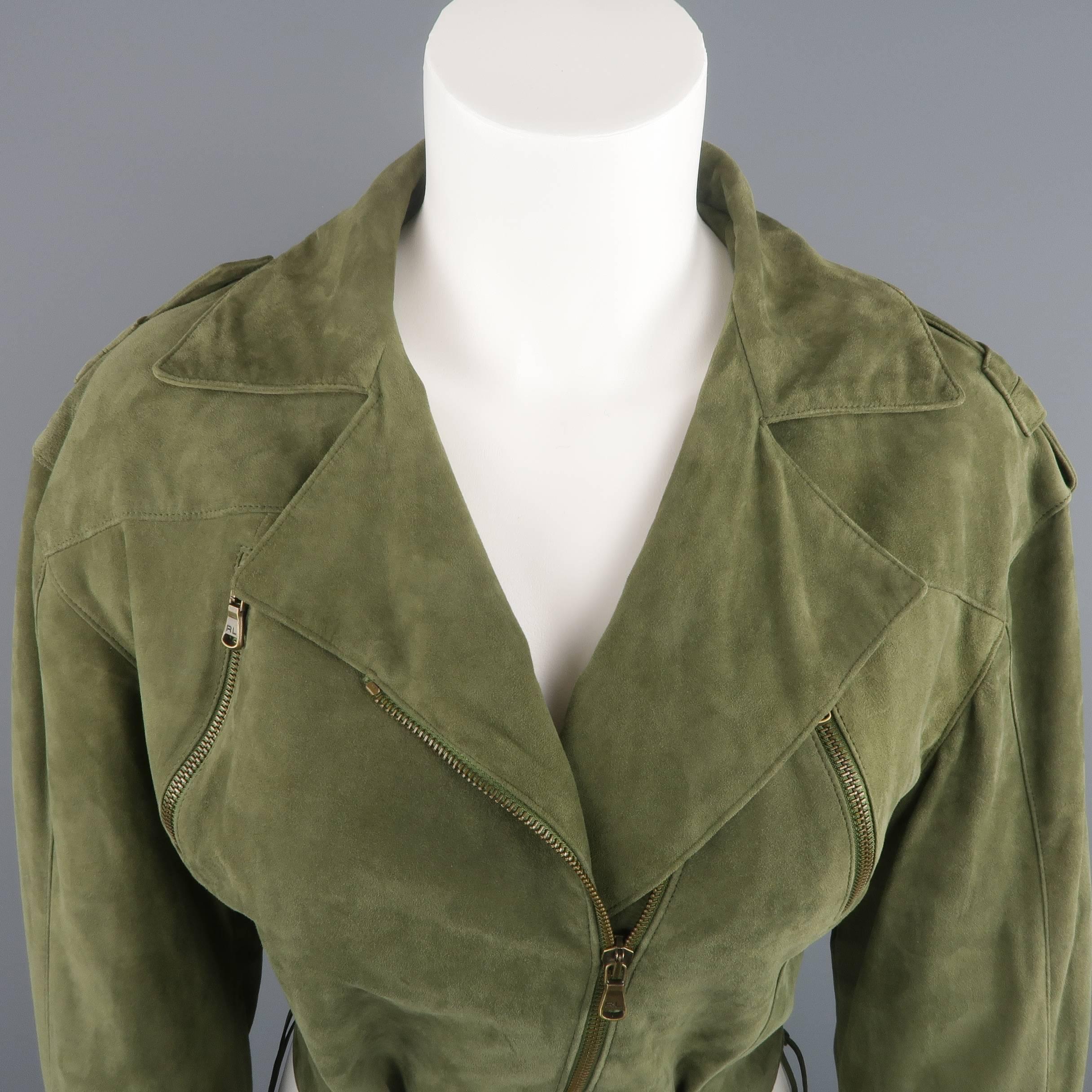 RALPH LAUREN BLACK LABEL cropped biker jacket comes in a light weight, soft, olive green suede and features a pointed collar lapel, gold tone asymmetrical zip front, epaulets, slanted zip pockets, lace up sides with grommets, frontal belted waist,