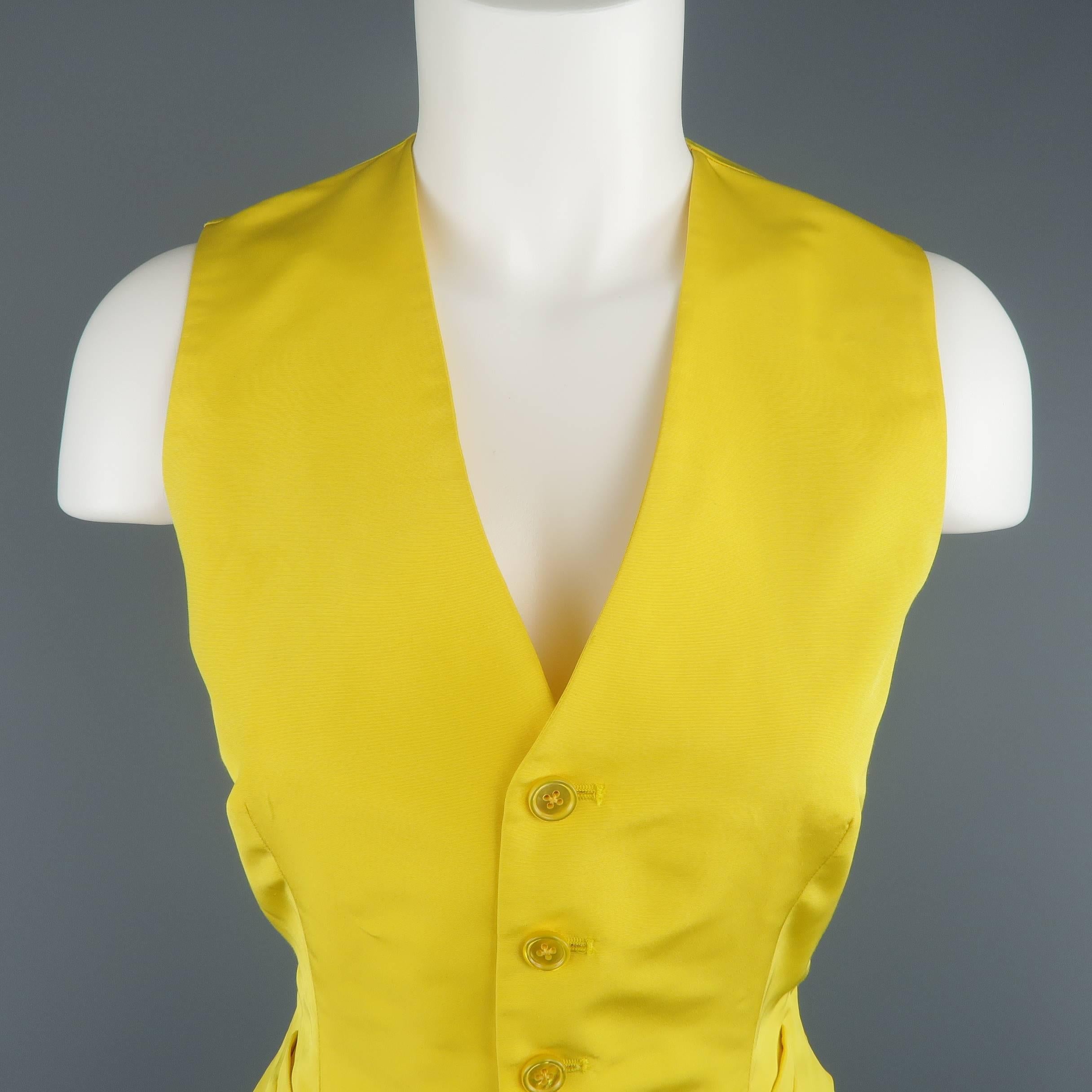 RALPH LAUREN COLLECTION dress vest comes in yellow silk twill with a light sheen and features a v neck line, five button front, and pleated back with belt. Made in USA.
 
Excellent Pre-Owned Condition.
Marked: 8
 
Measurements:
 
Shoulder: 12.5