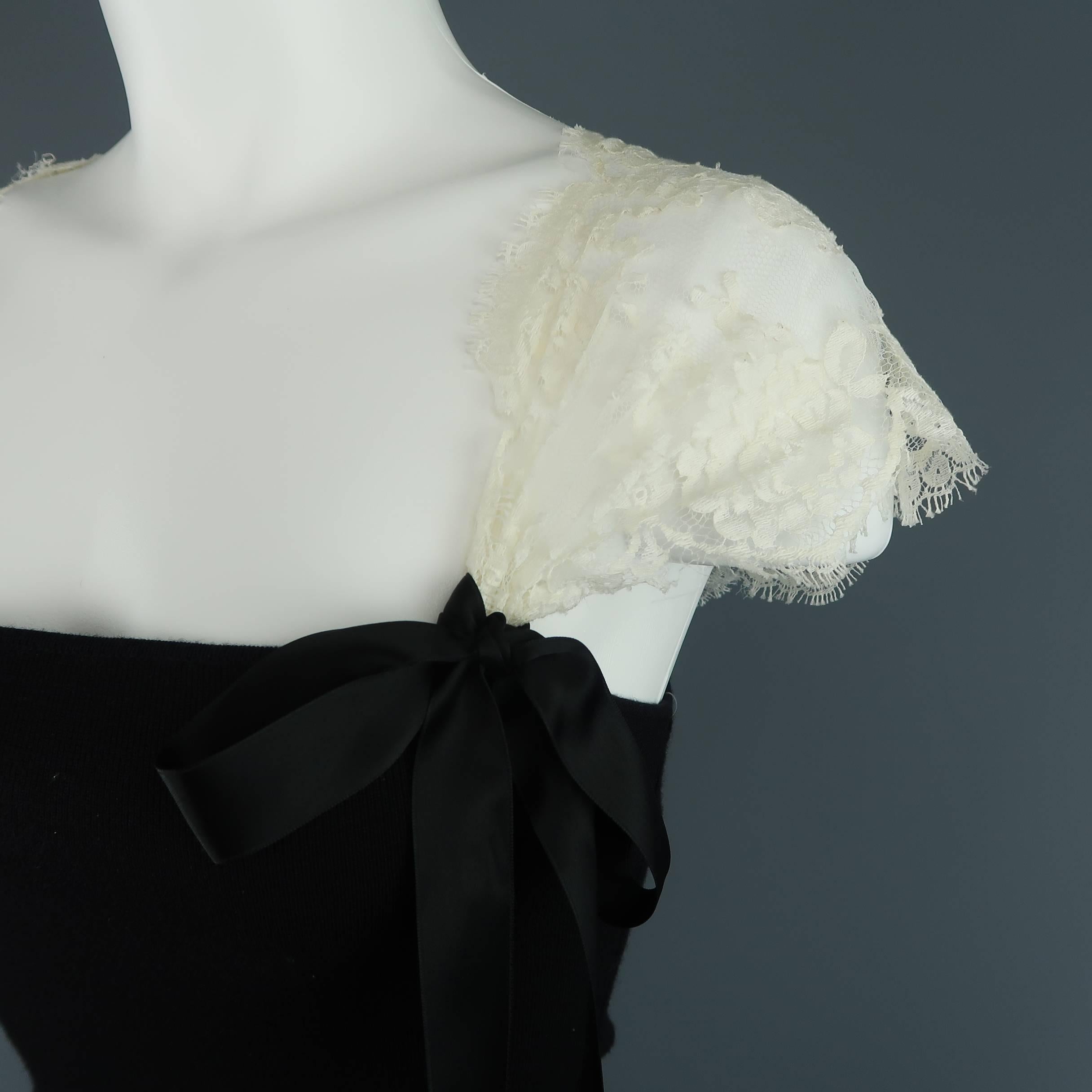 This gorgeous VALENTINO camisole top features a black wool knit tube bodice with thick cream silk lace shoulder straps adorned with black satin bows. Made in Italy.
 
Excellent Pre-Owned Condition.
Marked: S
 
Measurements:
 
Shoulder: 19 in.
Bust: