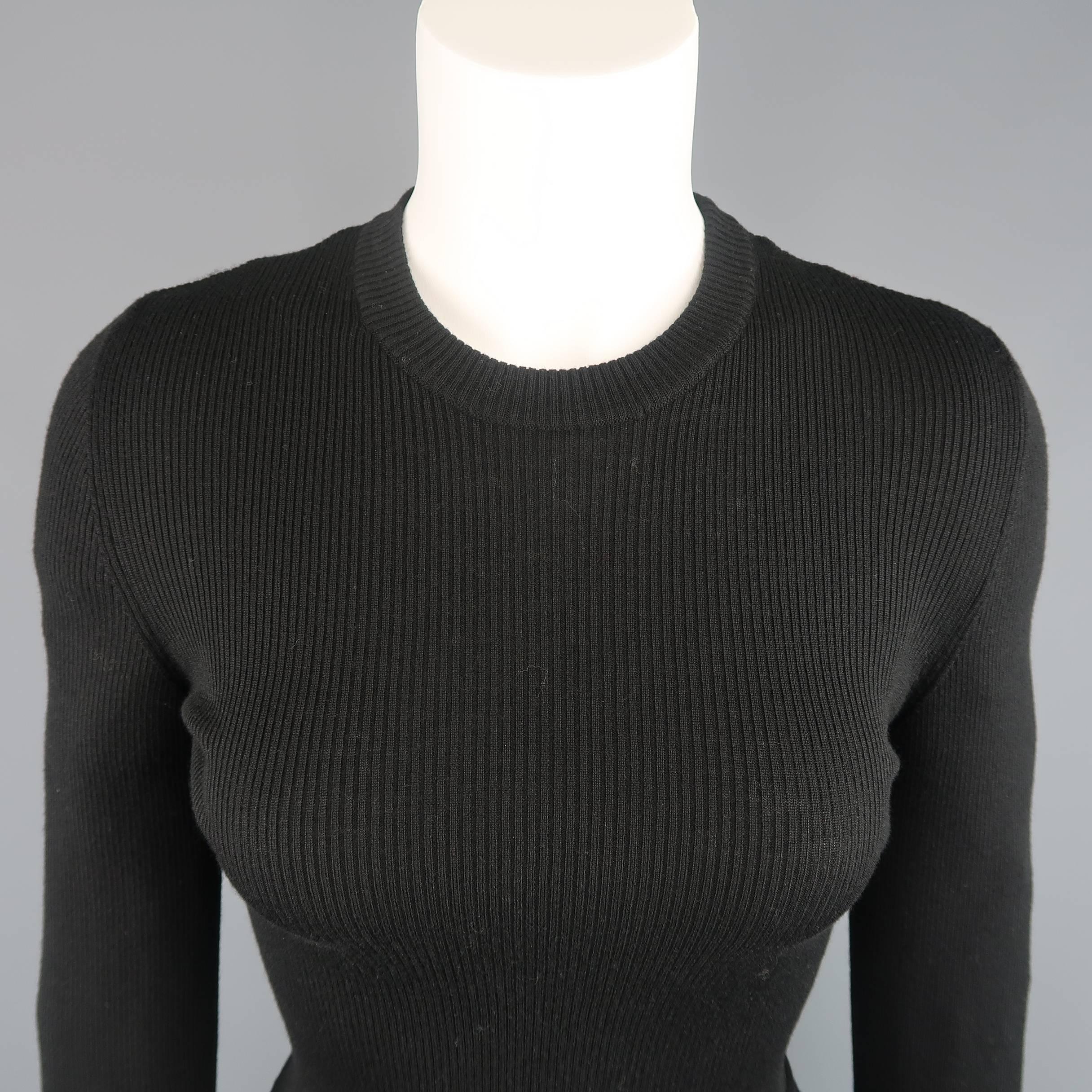 SALVATORE FERRAGAMO pullover sweater comes in a virgin wool ribbed knit and features a crewneck, long sleeves, and asymmetrical, directional knit peplum hem.  Made in Italy.
 
Excellent Pre-Owned Condition.
Marked: M
 
Measurements:
 
Shoulder: 16