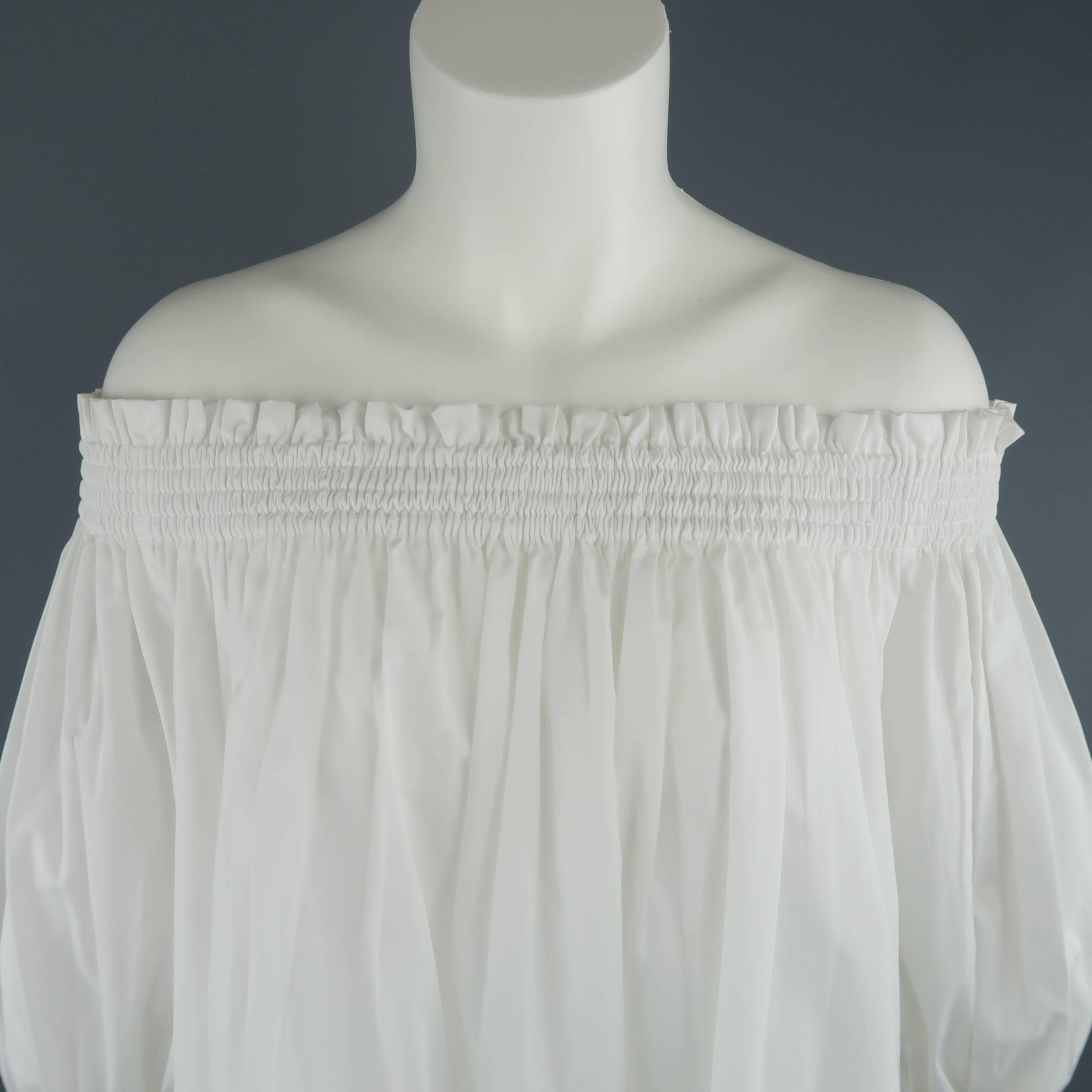 This gorgeous ALEXANDER MCQUEEN peasant blouse comes in white cotton and features a gathered stretch off the shoulder neckline, pleated A line body, and balloon sleeves with lace bell ruffle cuffs.  Made in Italy.
 
Excellent Pre-Owned