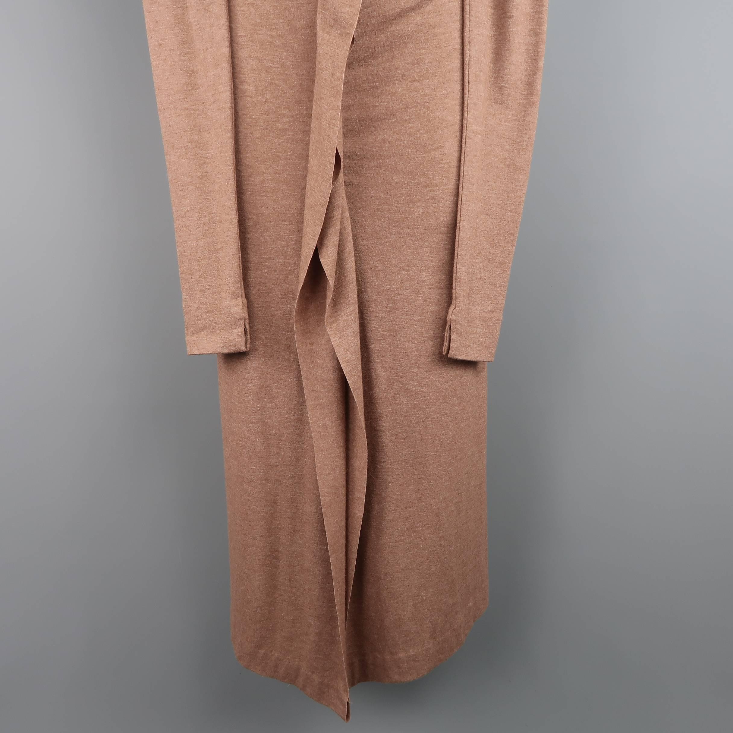 JEAN PAUL GAULTIER maxi dress comes in a tan wool rayon blend heather jersey and features a boat neckline, extra long sleeves, fitted silhouette, slit front, and asymmetrical ruffle. Made in Italy.
 
Excellent Pre-Owned Condition.
Marked: 8
