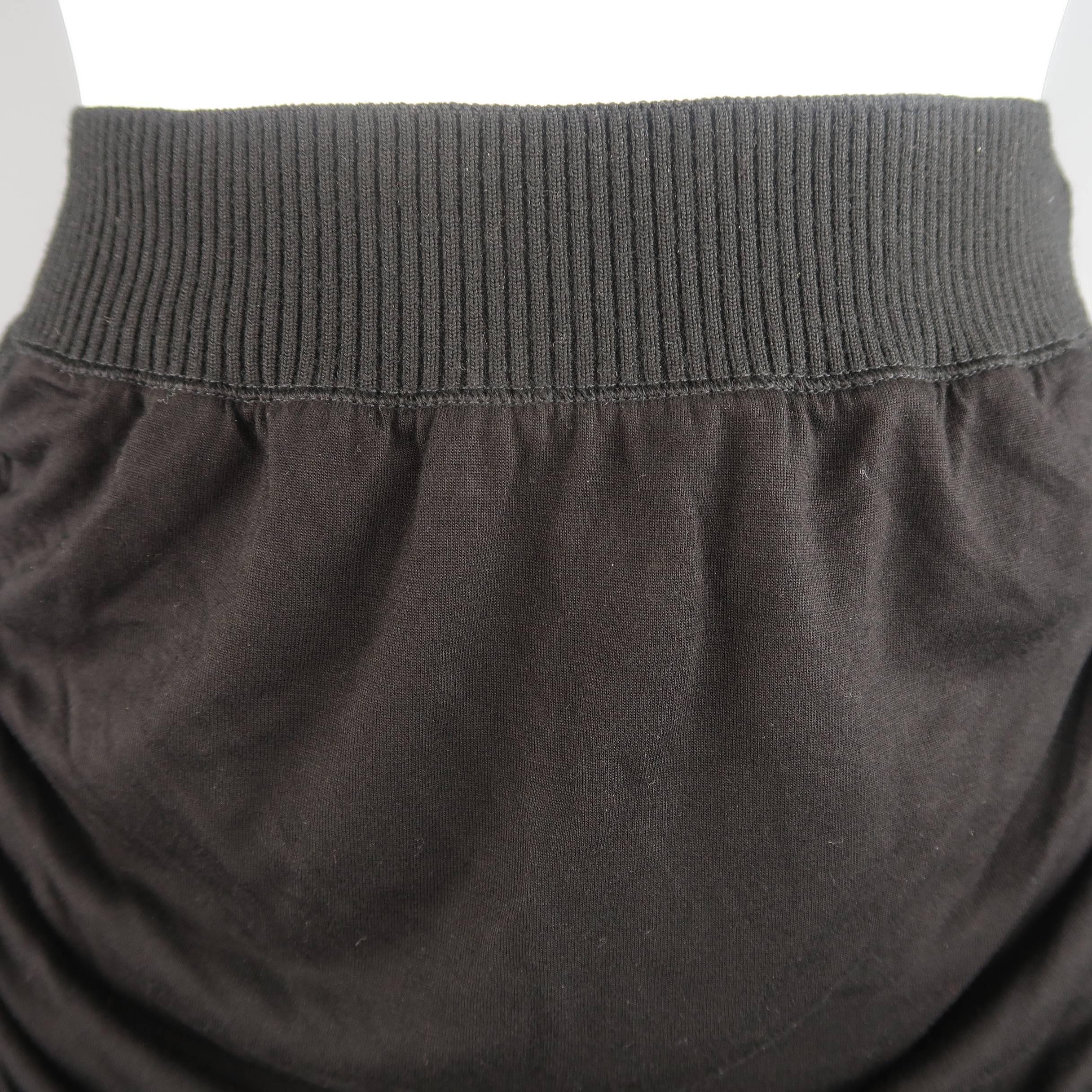 JEAN PAUL GAULTIER SOLEIL bodycon pencil skirt features ruched stretch nylon mid panels with ribbed wool knit waistband and sides  with micro-mesh liner.  Made in Italy.
 
Excellent Pre-Owned Condition.
Marked: M
 
Measurements:
 
Waist: 25 in.
Hip: