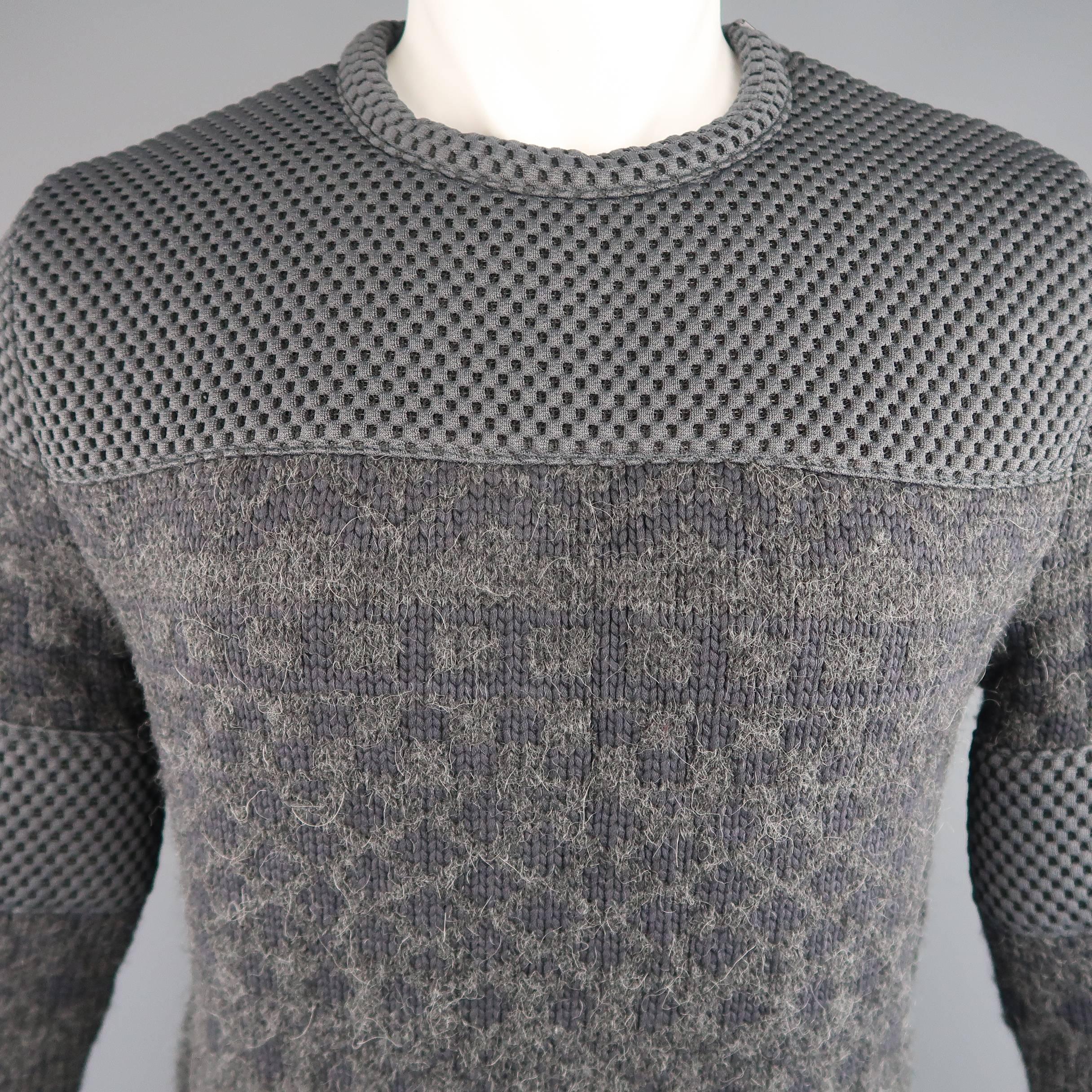 CALVIN KLEIN COLLECTION pullover sweater comes in a dark gray alpaca blend knit and features a round crewneck with shoulder zip, patterned mid section, and gray mesh panels. Fall 2015 Collection. Made in Italy.
 
Excellent Pre-Owned