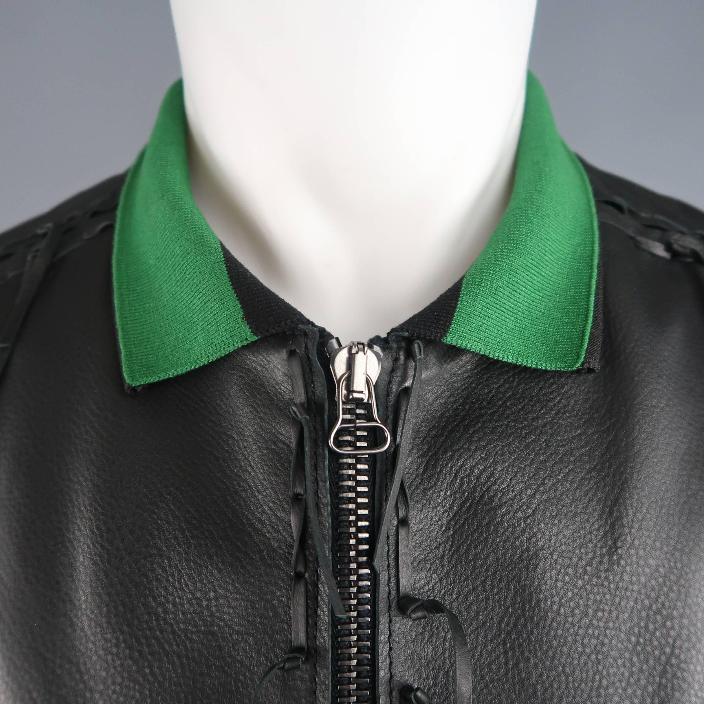 LANVIN tailored bomber jacket comes in soft calf leather and features a green and black ribbed knit collar, gunmetal zip front, ribbed cuffs, patch flap snap breast pockets, and woven fringe trim throughout. Made in Italy.
Good Pre-Owned