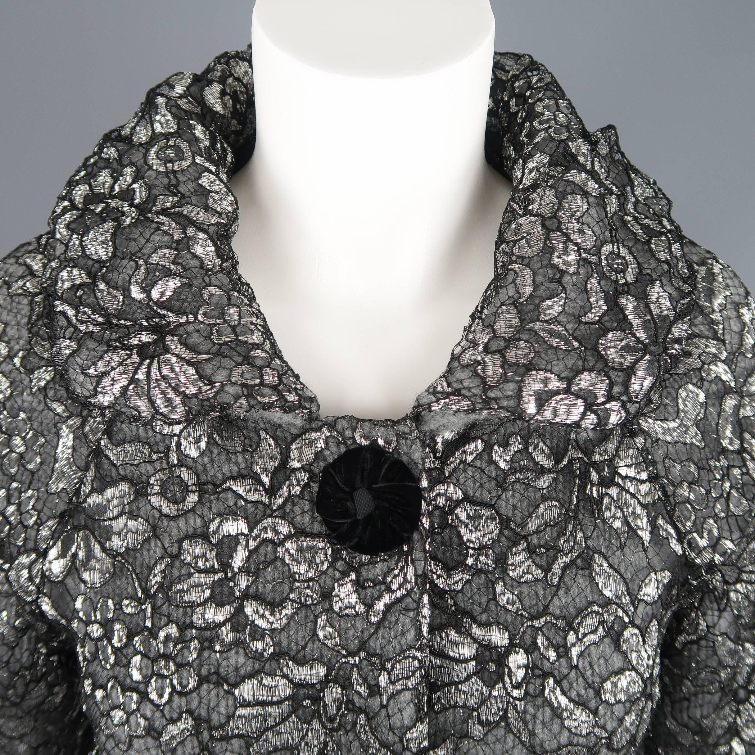 MARC JACOBS jacket comes in gray cashmere knit with a metallic silver lace overlay and features a round collar, retro silhouette, and three snap closure with black velvet buttons. Made in Italy.
 
Excellent Pre-Owned Condition.
Marked: S
