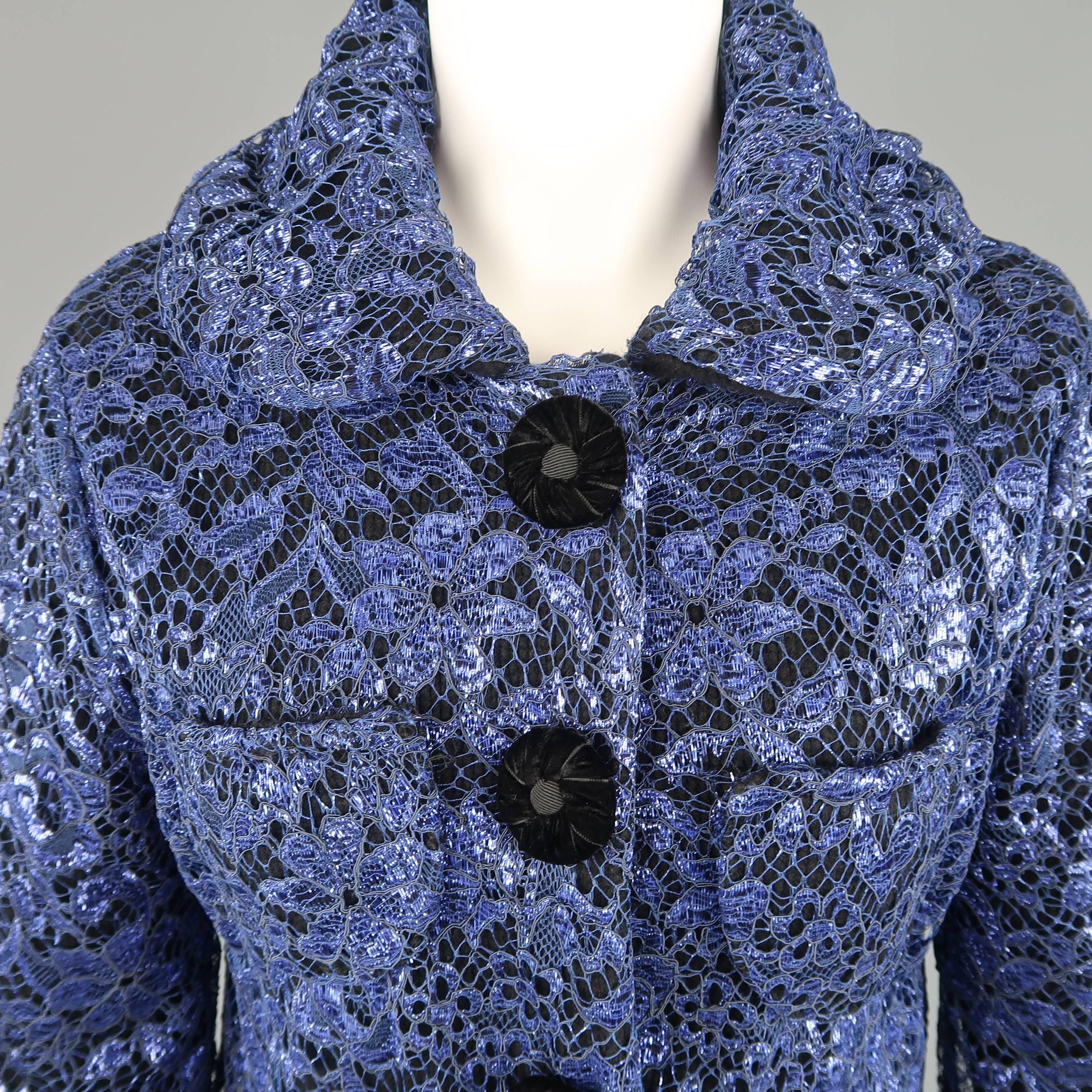 MARC JACOBS jacket comes in black cashmere knit with a metallic blue lace overlay and features a round collar, retro silhouette, patch pockets, and four snap closure with black velvet buttons. Made in Italy.
 
Excellent Pre-Owned Condition.
Marked: