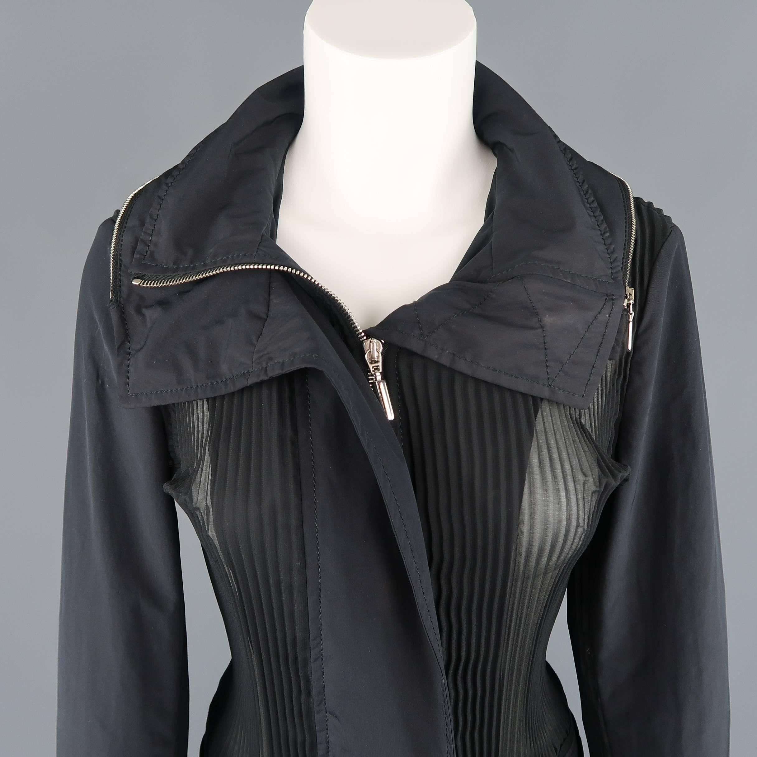 GIORGIO ARMANI jacket features a sheer , pleated chiffon body, hidden placket zip front, high collar, asymmetrical zip hood, and elastic back waistband with patch pockets. Imperfections on sleeves. As is. Made in Italy.
 
Good Pre-Owned