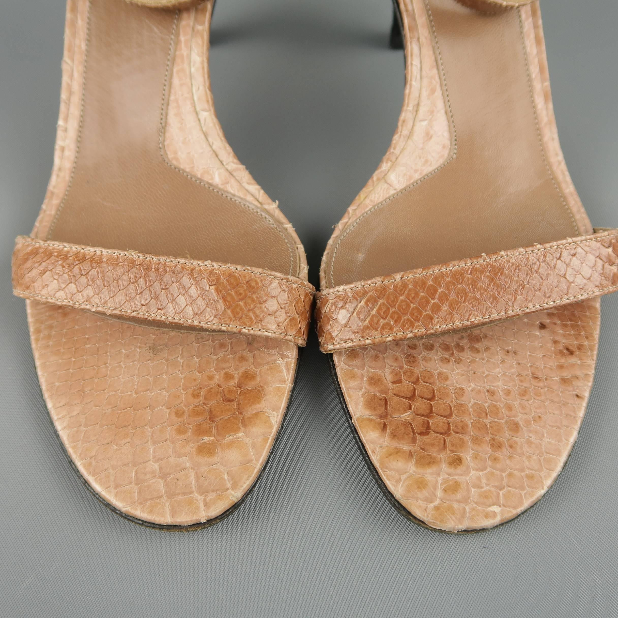 GUCCI sandals come in tan snake skin leather with a skinny toe strap and buckle ankle strap. Made in Italy.
 
Good Pre-Owned Condition.
Marked: IT 35.5 C
 
Measurements:
 
Heel: 2.5 in.

