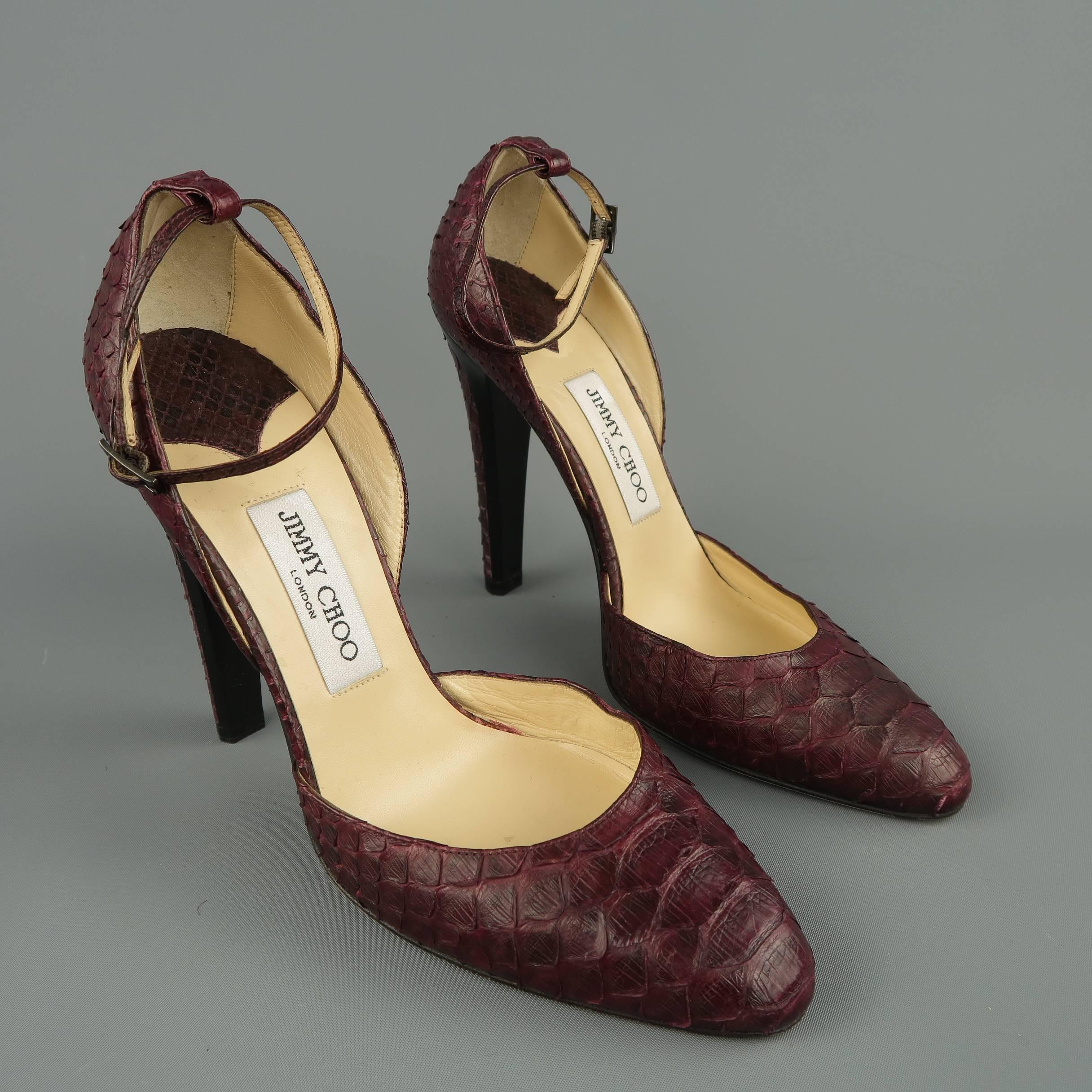 JIMMY CHOO d'orsay pumps come in plum purple python leather with a pointed toe, ankle strap, and thick black lacquered heel with leather panel. Made in Italy.
 
Excellent Pre-Owned Condition.
Marked: IT 40
 
Measurements:
 
Heel: 4.5 in.
