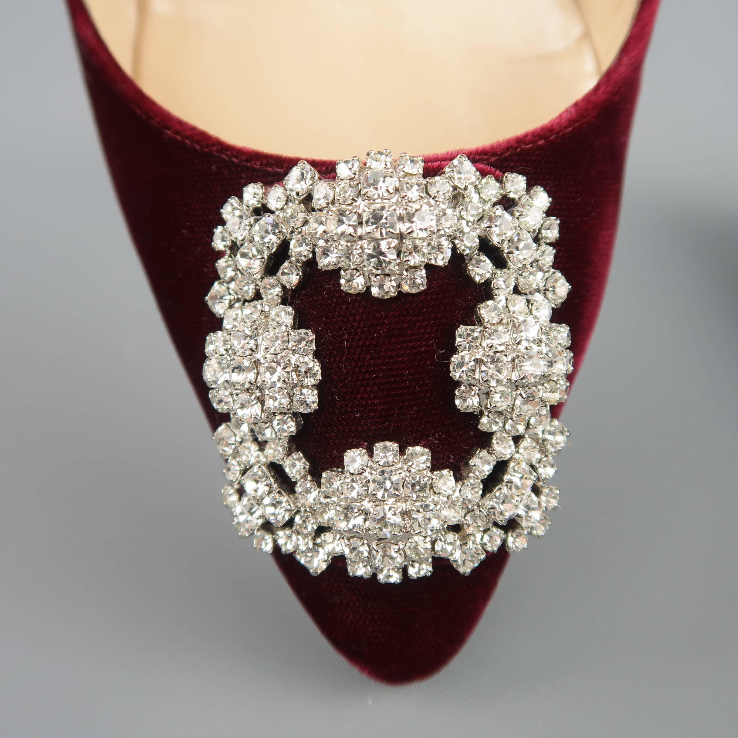MANOLO BLAHNIK Hangisi flats come in burgundy velvet with a pointed toe, Swarovski crystal studded buckle embellishment, and covered heel. Minor wear through velvet. As-is. Handmade in Italy.
 
Good Pre-Owned Condition.
Marked:IT 37.5
 
Outsole: