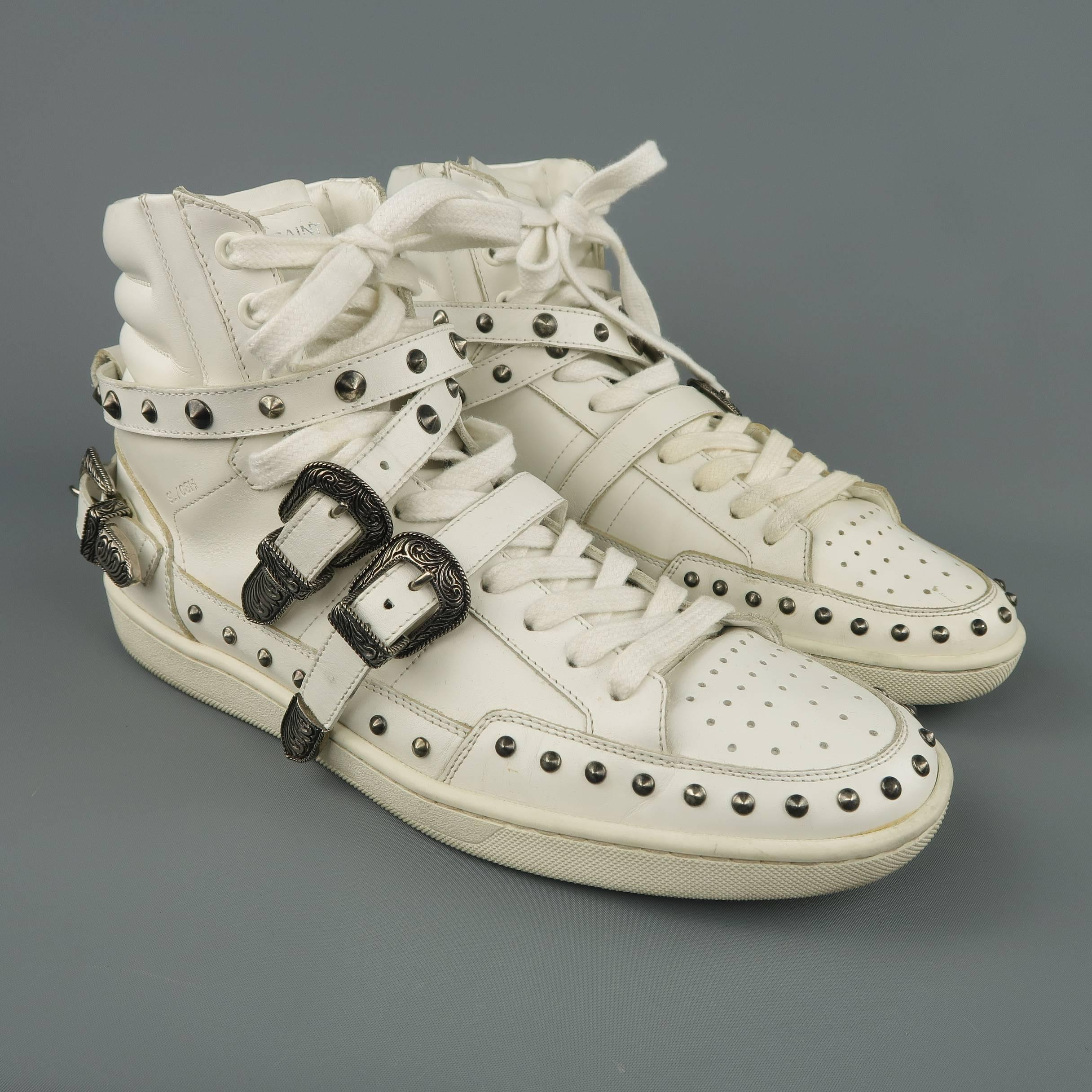 SAINT LAURENT SL/08H  high top sneakers come in white leather with a padded ankle, perforated toe, studded mid, and wrapped ankle strap with silver tone western buckle. Wear throughout. Made in Italy.
 
Fair Pre-Owned Condition.
Marked: IT 41.5
