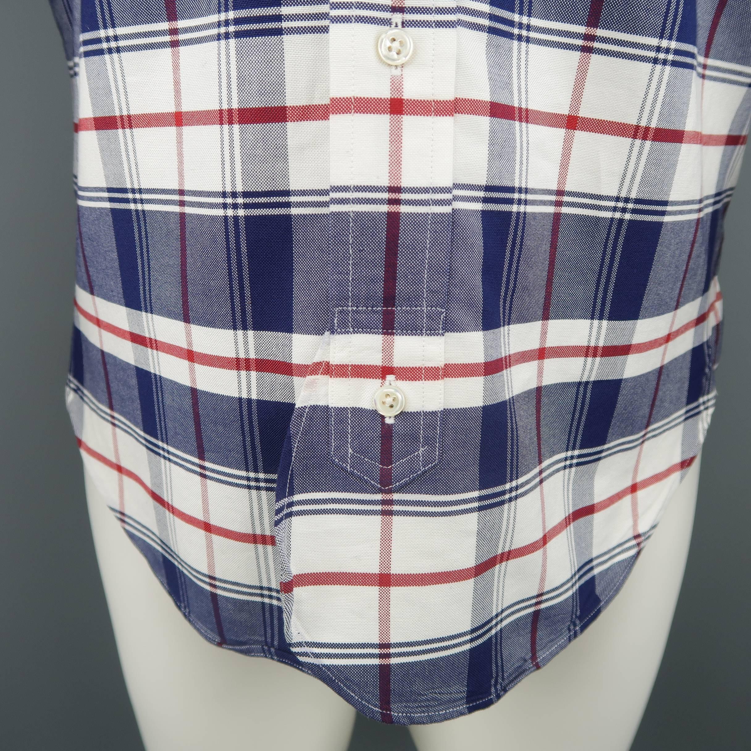 BLACK FLEECE by THOM BROWNE shirt comes in navy blue. white, and red plaid print cotton with a pointed button down collar, patch breast pocket, curved hem detail, and back tab. Made in USA.
 
Excellent Pre-Owned Condition.
Marked: BB0
