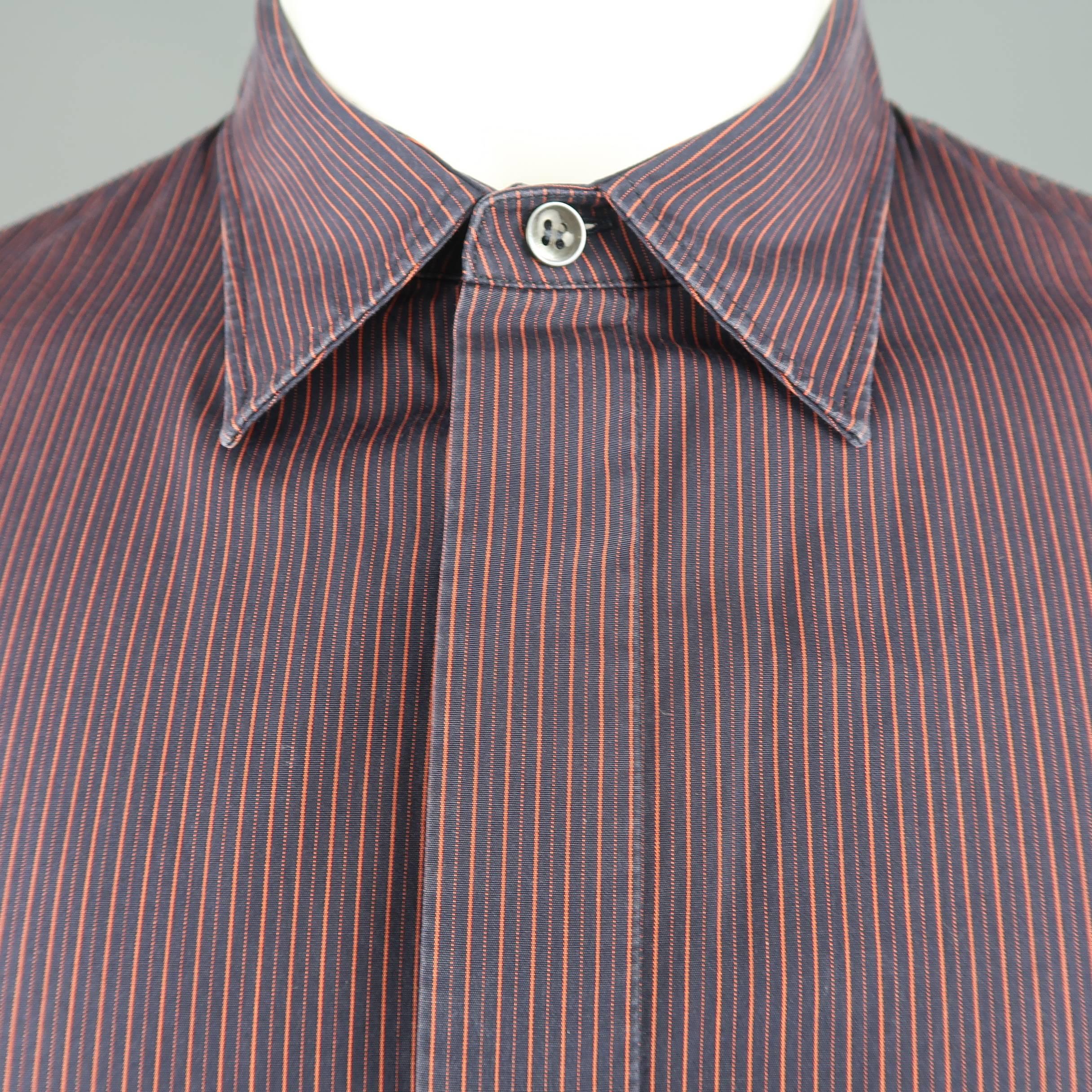 MAISON MARTIN MARGIELA shirt comes in navy and burgundy striped cotton with a pointed collar, hidden placket button up front, and signature stitch back. Made in Italy.
 
Good Pre-Owned Condition.
Marked: IT 50
 
Measurements:
 
Shoulder: 19