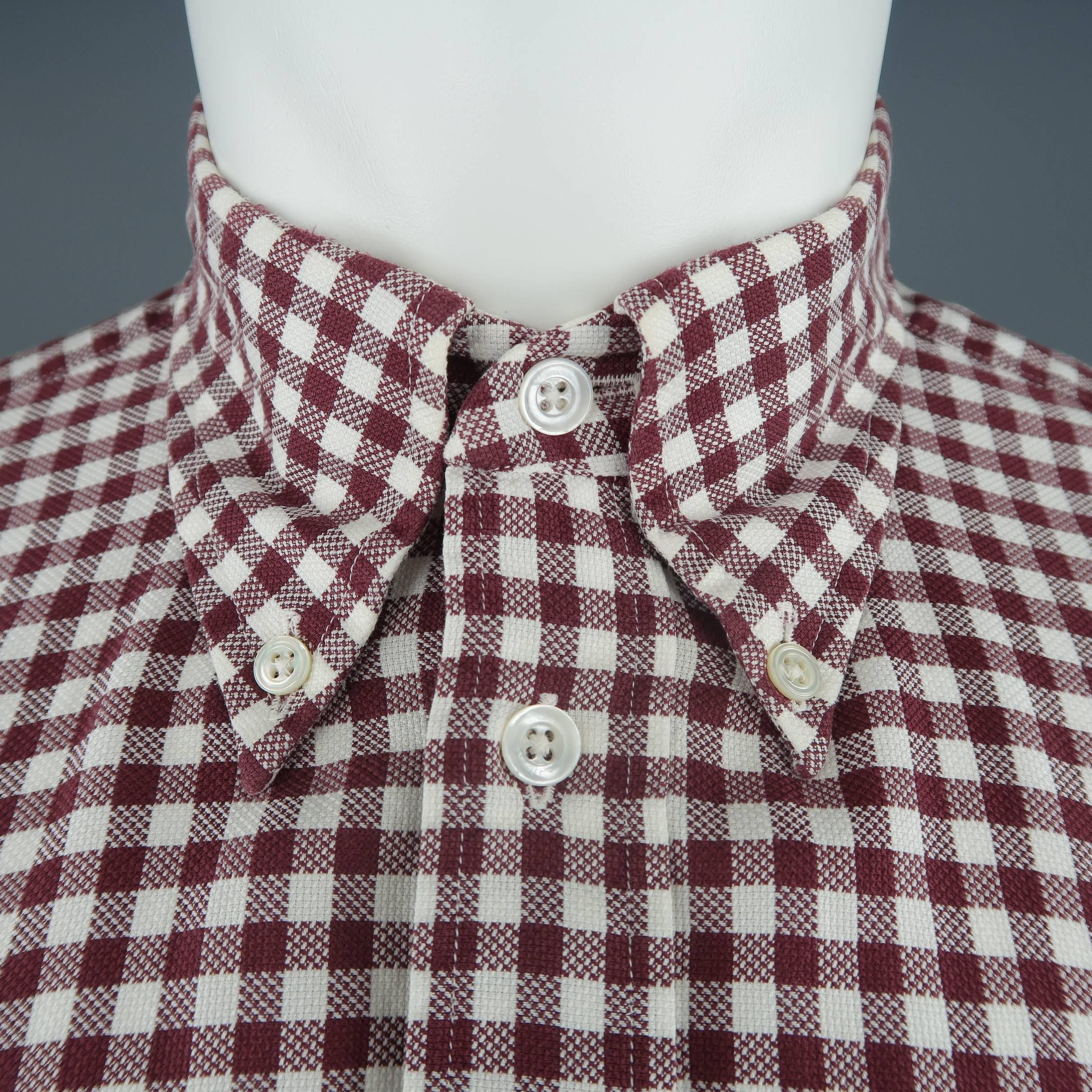 Vintage HERMES shirt comes in burgundy and white gingham plaid cotton with a pointed button down collar and breast patch pocket. Made in France.
 
Excellent Pre-Owned Condition.
Marked: 40 / 15 3/4
 
Measurements:
 
Shoulder: 17 in.
Chest: 42