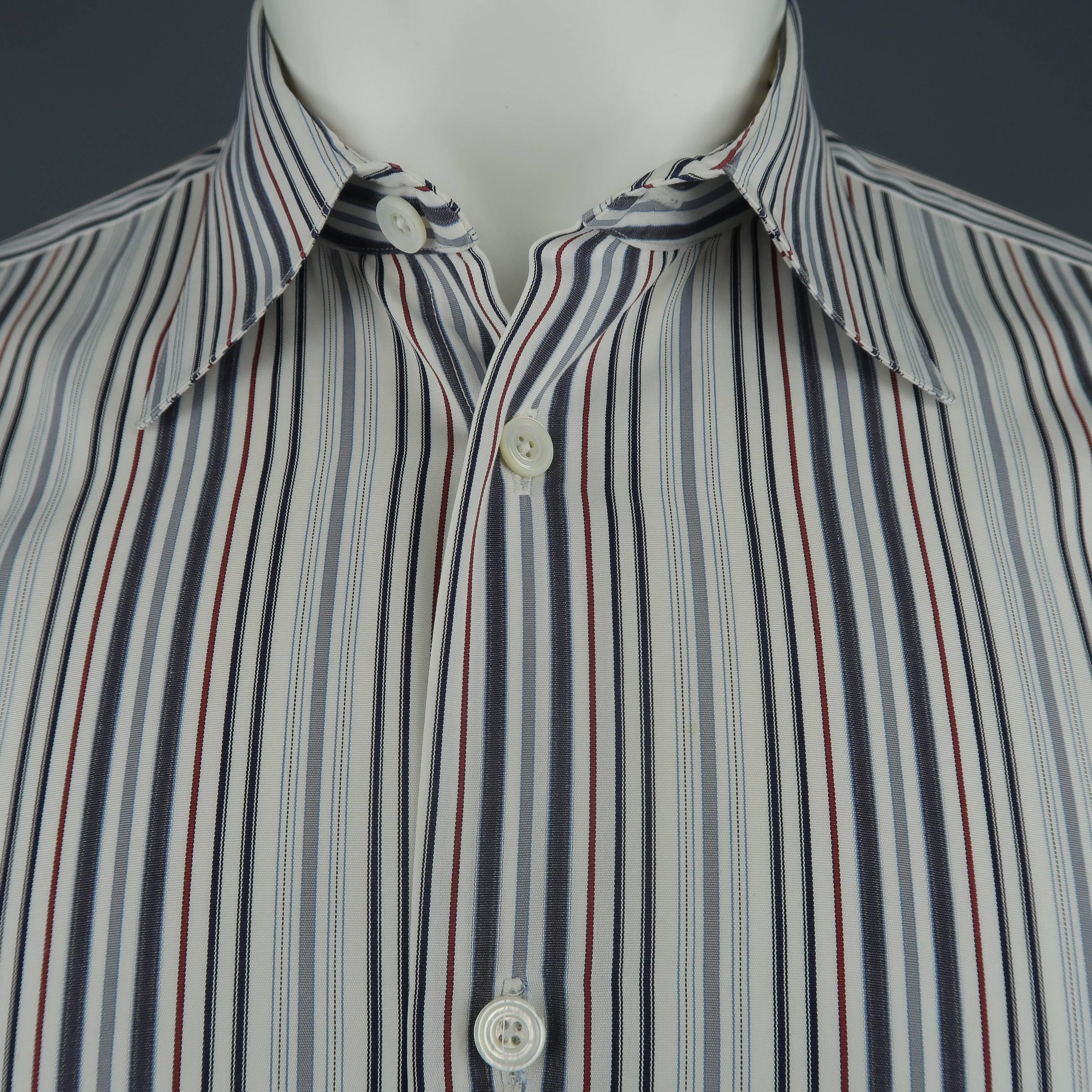 HERMES dress shirt comes in gray, white, and red striped cotton with a pointed collar, and metal button cuffs. Made in France.
 
Excellent Pre-Owned Condition.
Marked: 39  15 1/2
 
Measurements:
 
Shoulder: 17 in.
Chest: 41 in.
Sleeve: 23