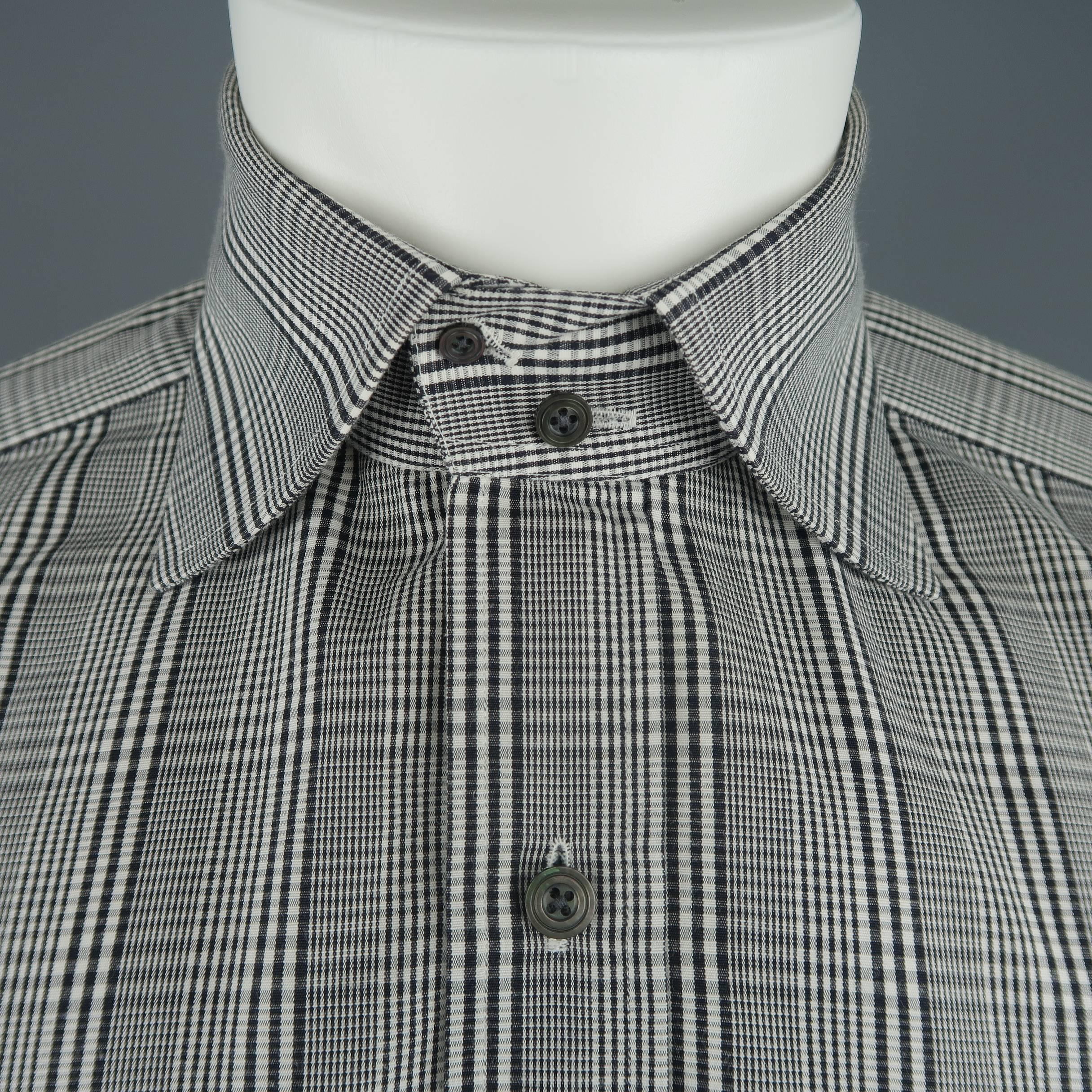 TOM FORD dress shirt comes in black and white plaid cotton with a two button spread collar and two button cuffs. Made in Italy.
 
Excellent Pre-Owned Condition.
Marked: 40  15 3/4
 
Measurements:
 
Shoulder: 17 in.
Chest: 42 in.
Sleeve: 27