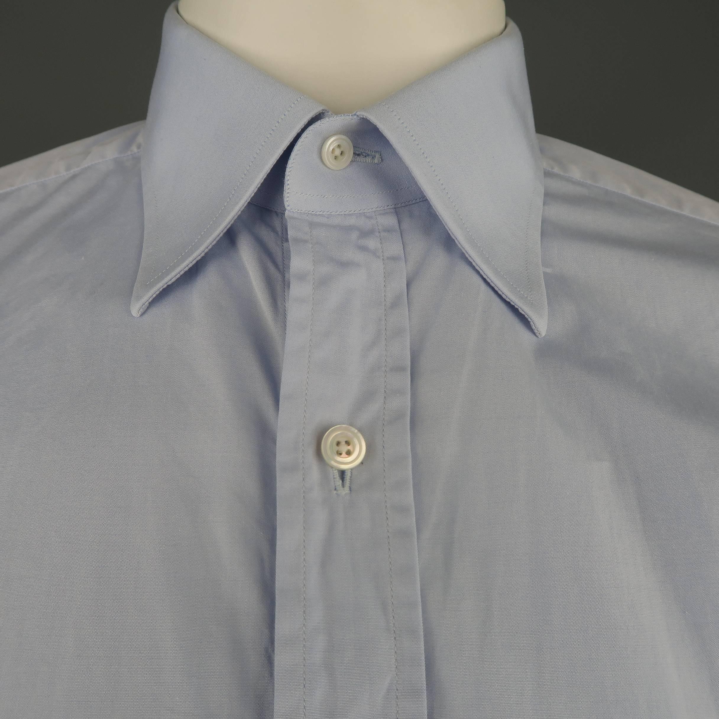 TOM FORD dress shirt comes in light blue cotton with a pointed collar and two button cuffs. Made in Switzerland.
 
Good Pre-Owned Condition.
Marked: 40  15 3/4
 
Measurements:
 
Shoulder: 17 in.
Chest: 44 in.
Sleeve: 26 in.
Length: 30 in.

