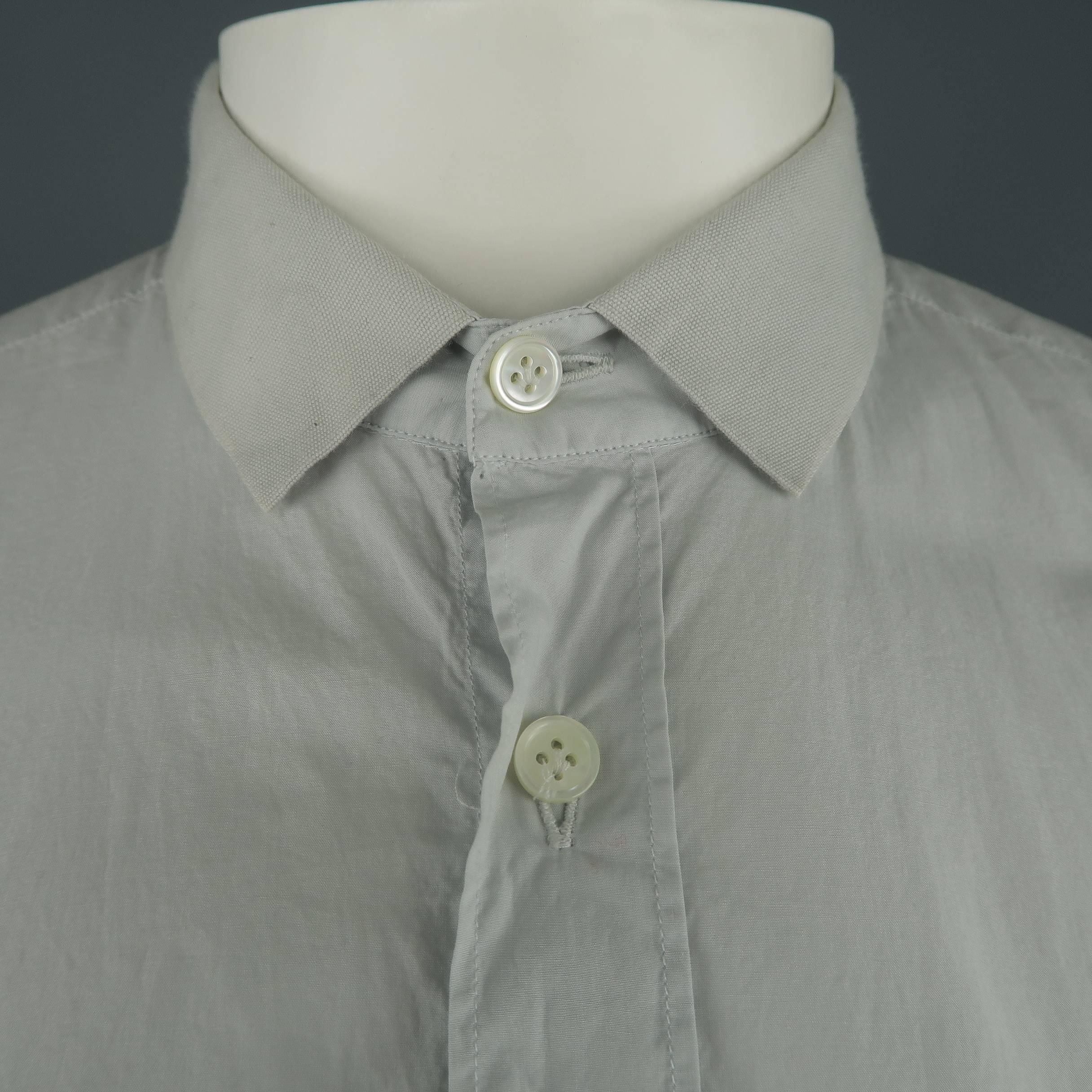 LANVIN shirt comes in light gray cotton with a canvas ribbon collar. Made in Italy.
 
Good Pre-Owned Condition.
Marked: 41  15
 
Measurements:
 
Shoulder: 17 in.
Chest: 44 in.
Sleeve: 26 in.
Length: 29 in.
