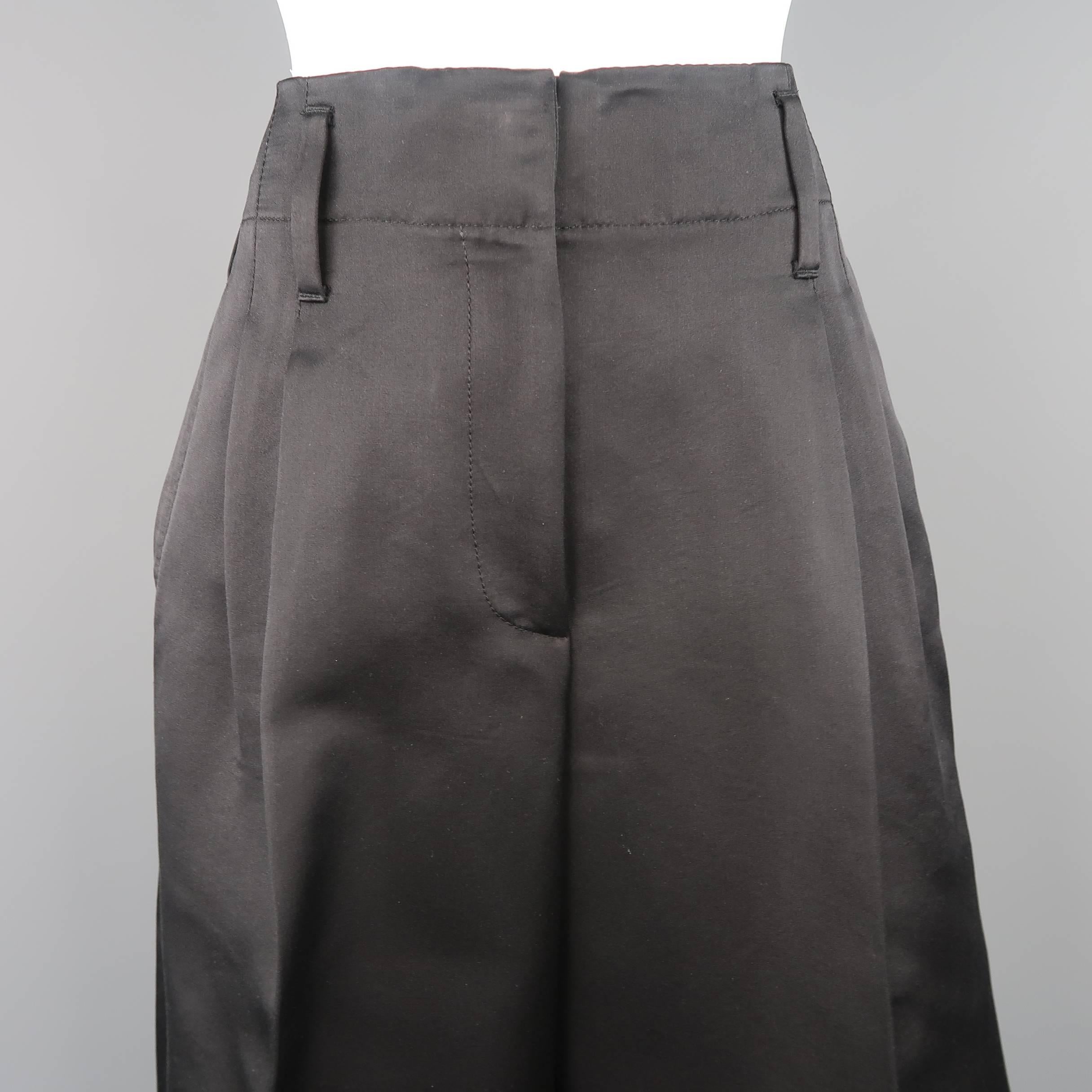 MARC JACOBS culottes come in black silk satin with a double pleat, wide leg, and cuffed hem. Made in USA.
 
Excellent Pre-Owned Condition.
Marked: 6
 
Measurements:
 
Waist: 30 in.
Rise: 13 in.
Inseam:  23 in.
Leg Opening: 31 in.
