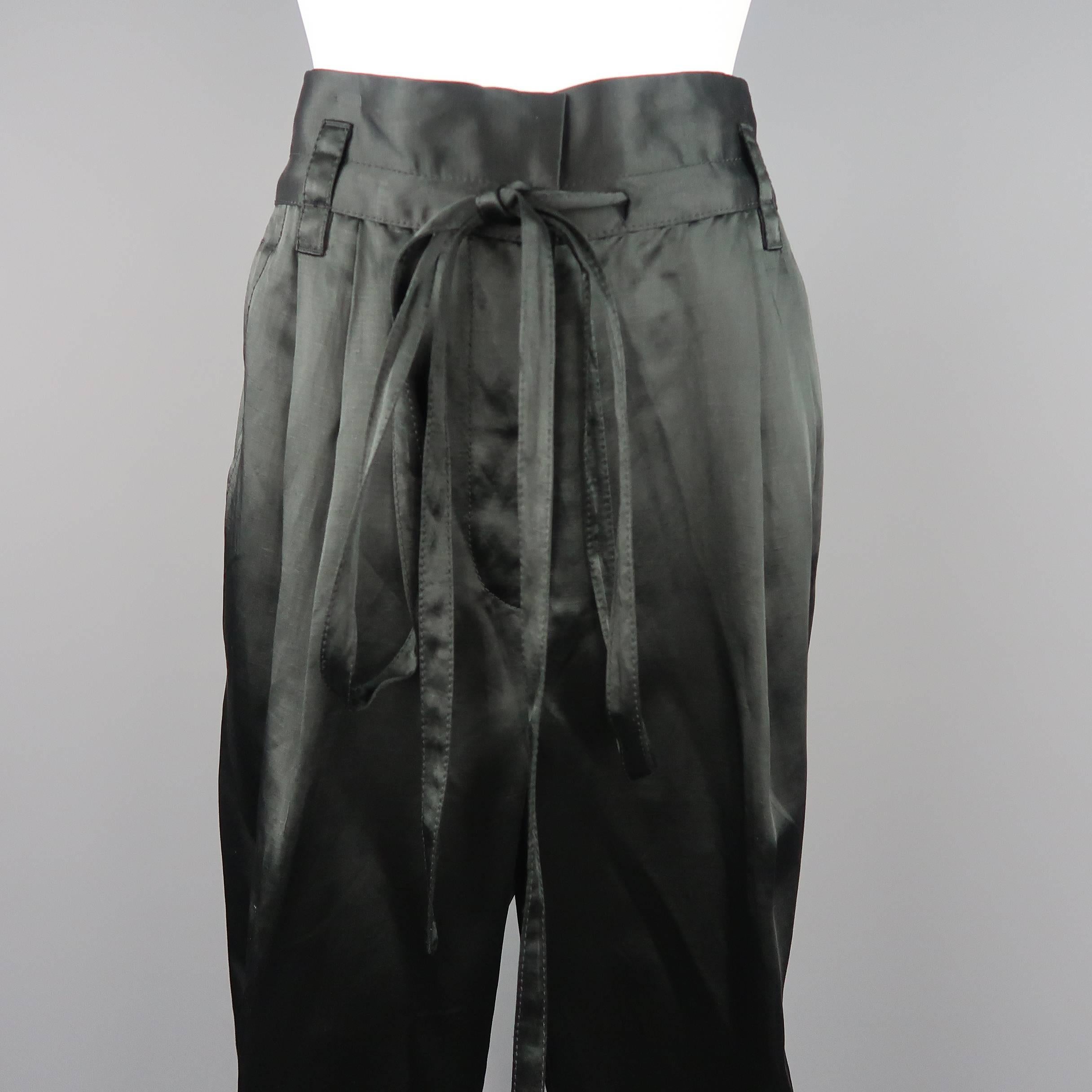 MARC JACOBS trousers come in a dark green black linen blend satin with a double pleat, drawstring waistband, and cuffed hem. Made in USA.
 
Good Pre-Owned Condition.
Marked: 4
 
Measurements:
 
Waist: 32 in.
Rise: 15 in.
Inseam: 25 in.
