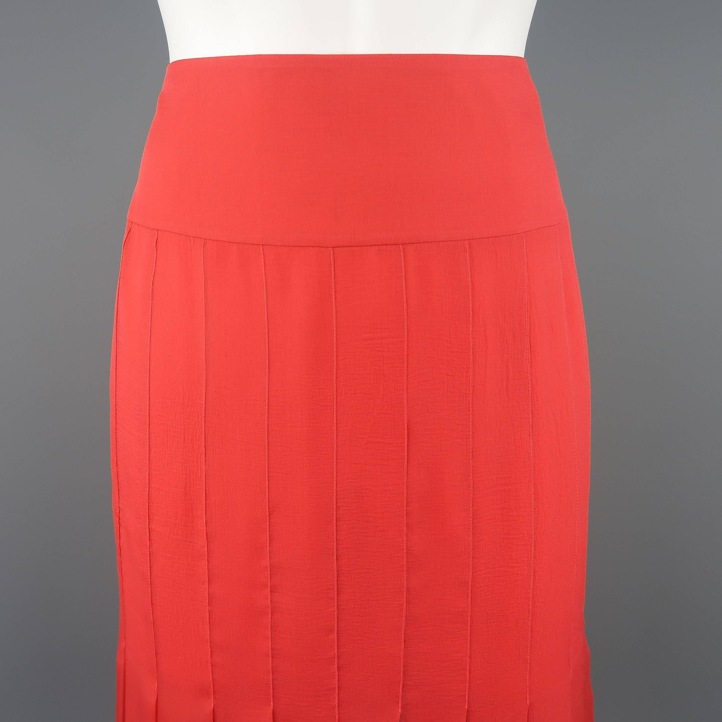 CHANEL pencil skirt comes in light red silk crepe chiffon with a box pleated construction, pleated hem, and thick waistband. Made in France.
 
Excellent Pre-Owned Condition.
Marked: FR 40  04P
 
Measurements:
 
Waist: 30 in.
Hip: 40 in.
Length: 22.5