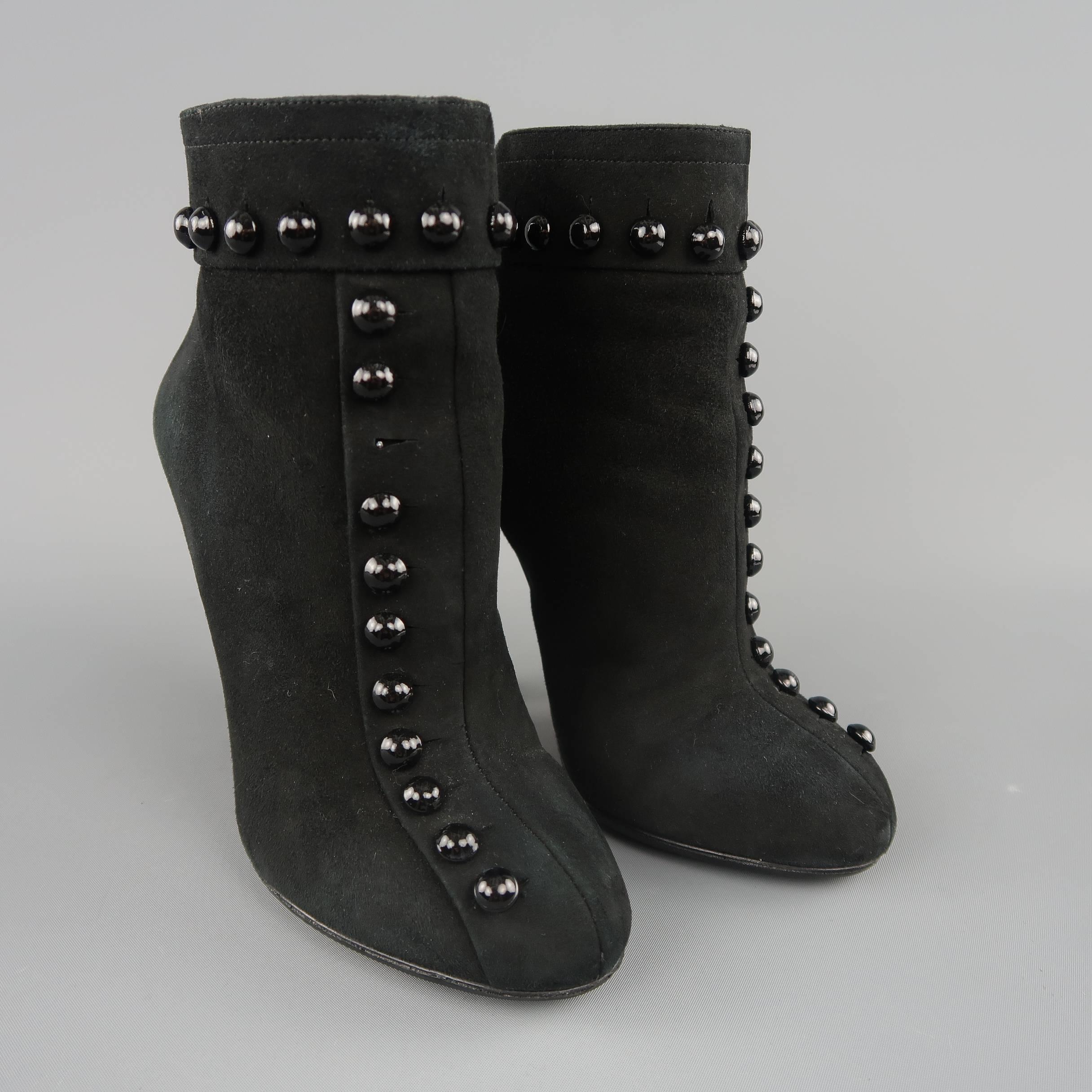 ALAIA booties come in black suede with a pointed toe, back zip closure, covered heel, and button stud details. Missing a button on right shoe. As-is. Otherwise great condition. With box. Made in Italy.
 
Fair Pre-Owned Condition.
Marked: IT 36.5
