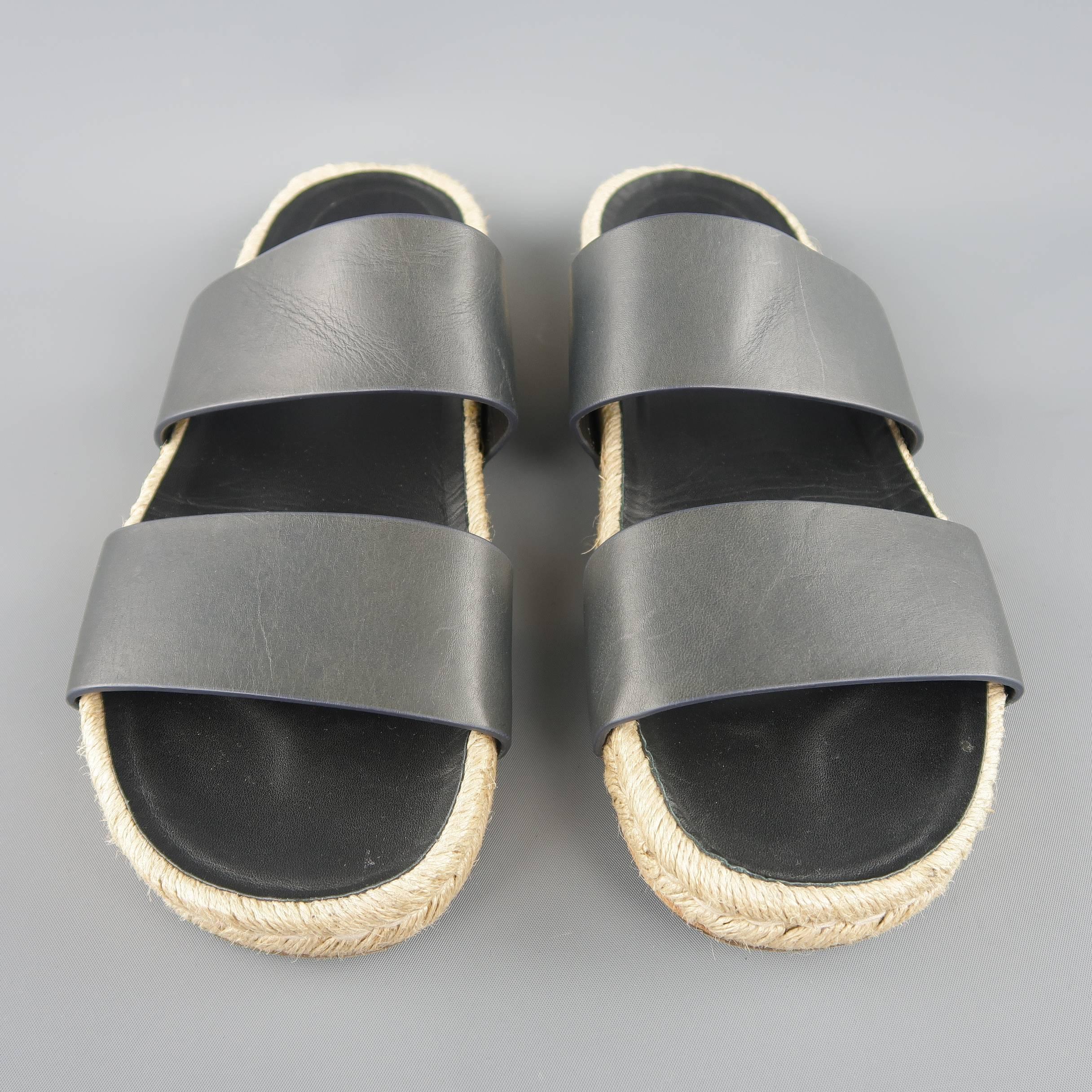 BALENCIAGA sandals feature two thick leather straps on a beige woven espadrille sole. Made in Spain.
 
Excellent Pre-Owned Condition.
Marked: IT 43
 
Outsole: 11.5 x 4 in.
