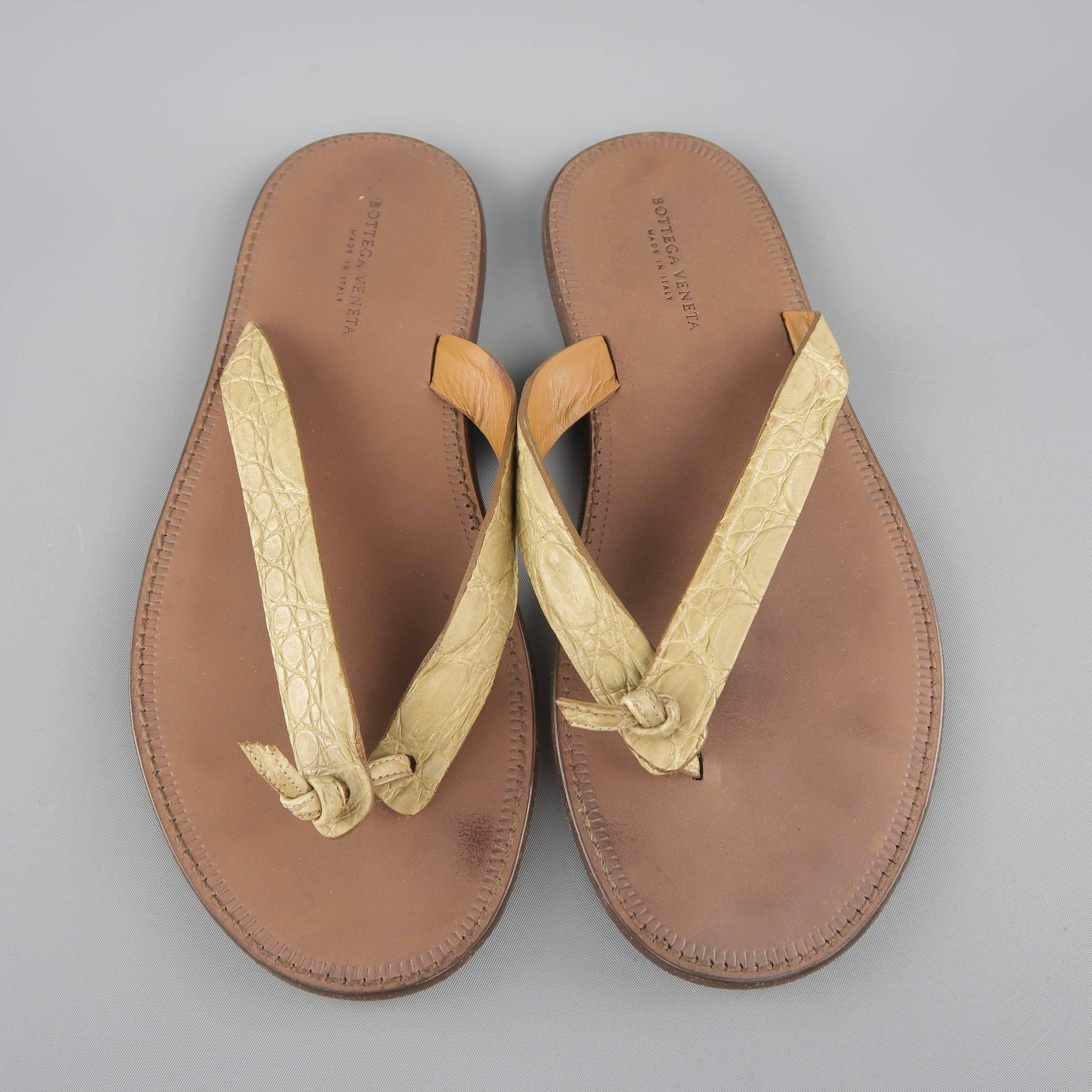 BOTTEGA VENETA sandals feature thick beige alligator embossed leather thong straps with a brown sole. Made in Italy.
 
Good Pre-Owned Condition.
Marked: IT 41
 
Outsole: 11 x 4 in.
