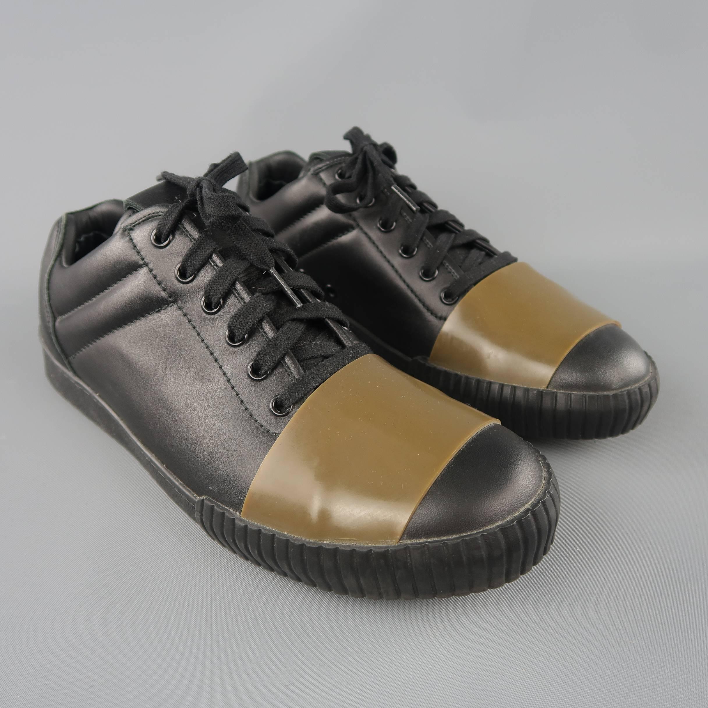 MARNI low top sneakers come in smooth black leather with quilted sides, thick rubber sole with woven bottom, and olive green rubber strap detail. Made in Italy.
 
Excellent Pre-Owned Condition.
Marked: IT 43
 
Outsole: 11.5 x 4 in.
