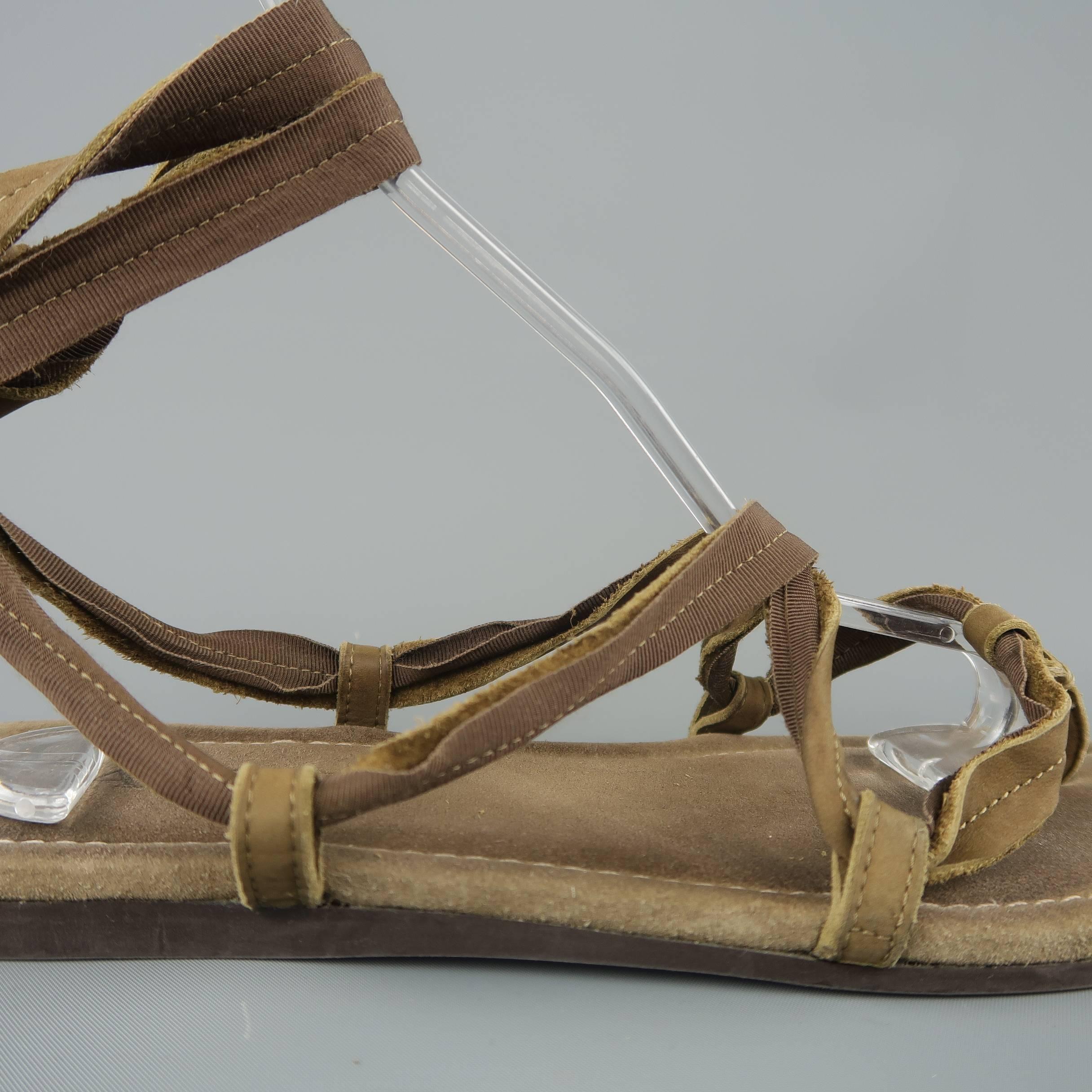 LANVIN gladiator sandals feature ribbon lined leather tied ankle straps on a suede sole. Wear throughout. As-is. Made in Italy.
 
Fair Pre-Owned Condition.
Marked: (no size)
 
Outsole: 11 x 4 in.
