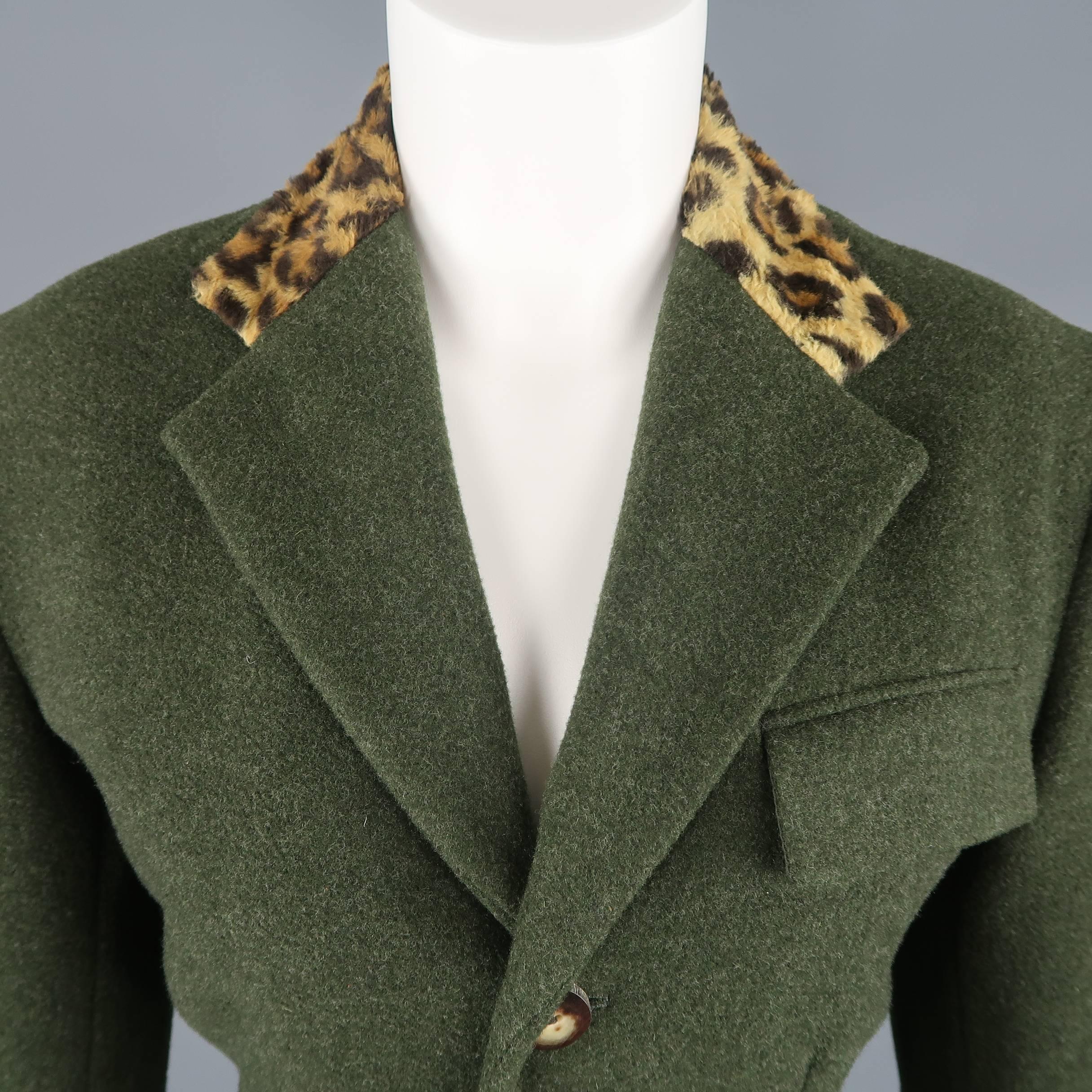RALPH LAUREN COLLECTION jacket comes in forest green cashmere wool blend felt with a notch lapel, three wooden button closure, slanted flap pockets, and leopard print fuzzy collar and cuffs. Matching skirt sold separately. Made in USA.
 
Good