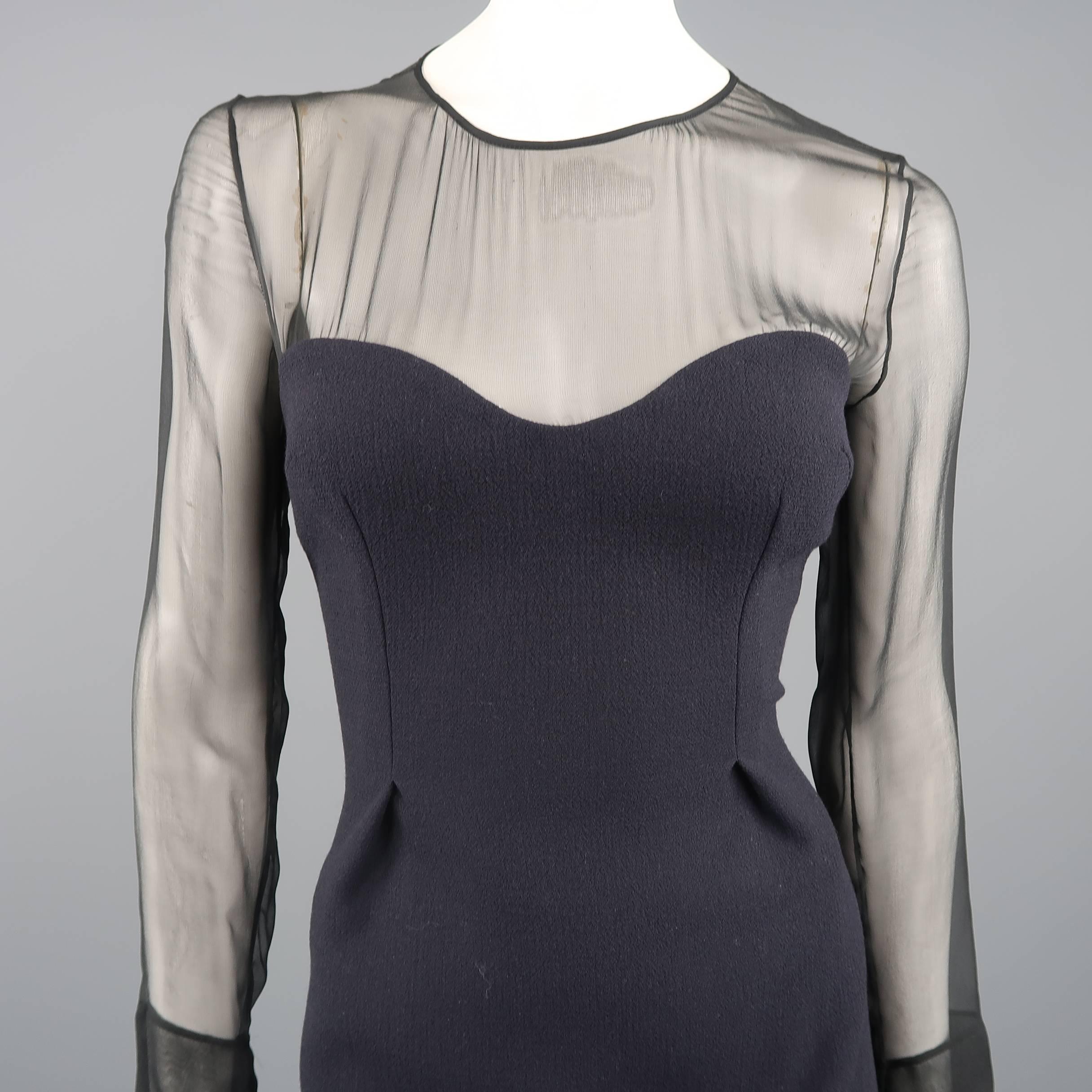 PRADA cocktail dress features a textured navy blue wool body with a sweetheart neckline, pleated front, and black sheer chiffon long sleeve top. Made in Italy.
 
Excellent Pre-Owned Condition.
Marked: IT 42
 
Measurements:
 
Shoulder: 15 in.
Bust: