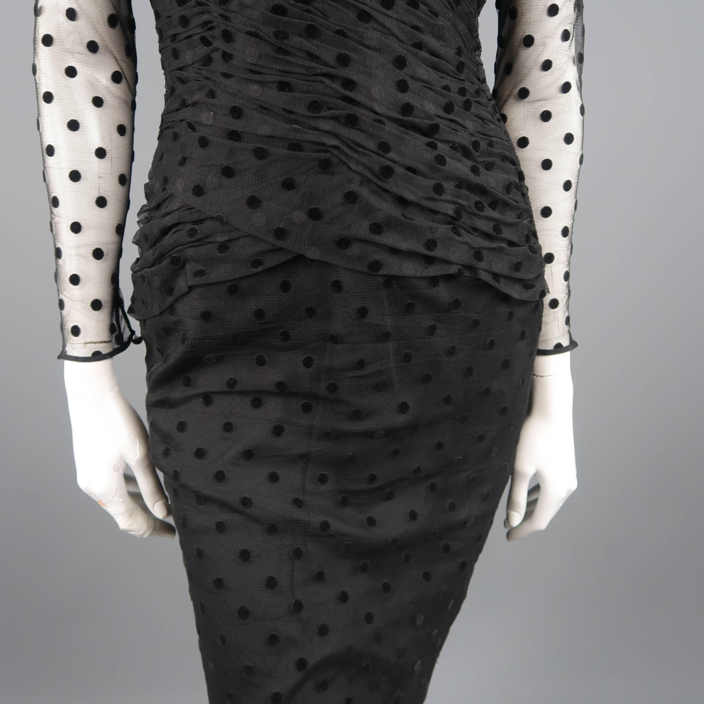 Vintage 1980'S VICKY TIEL COUTURE cocktail dress comes in black silk tulle with velvet polka dots and features a sheer long sleeve top, pleated sweetheart bustier bodice, pencil skirt, open back, and layered bustle at back. Made in France.
 
Good