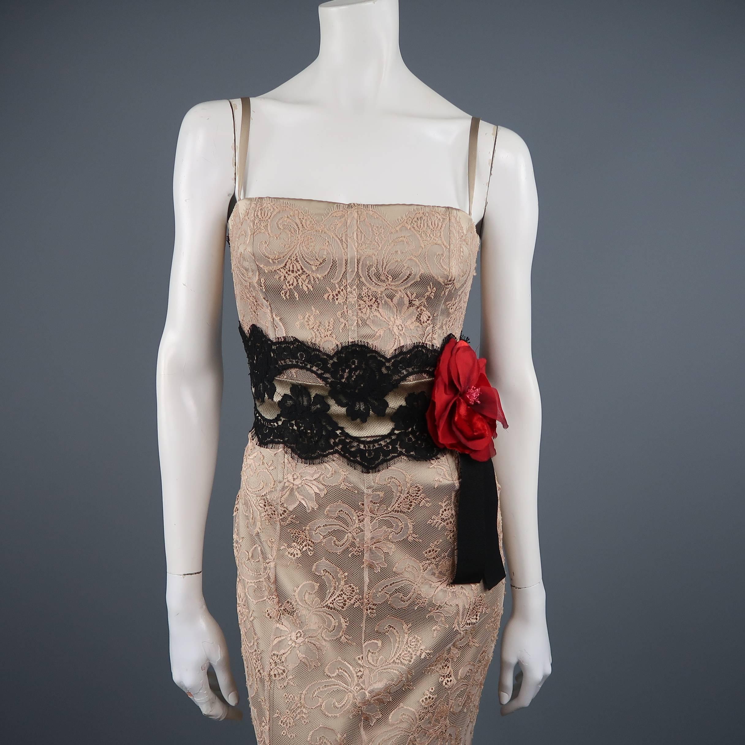 This stunning DOLCE & GABBANA evening gown beige silk satin with a lace overlay and features a boned bustier bodice, thick black lace waistband, and crimson red chiffon and velvet flower applique at waist. Made in Italy.  Retailed: $4500.00
