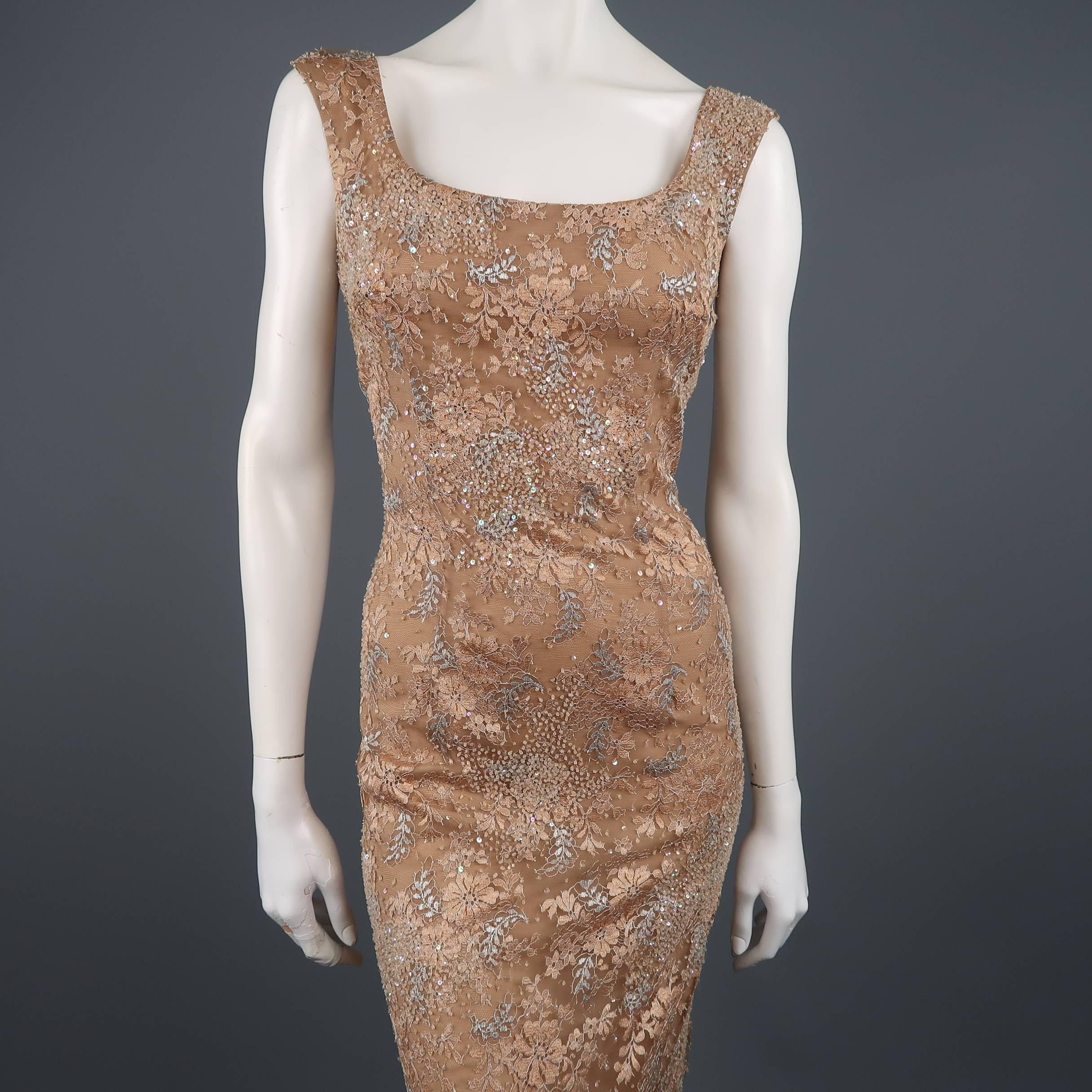 VERA WANG evening gown comes in layered beige silk chiffon with sequin beaded metallic lace overlay and features thick straps, a scoop neckline, and fitted body. Made in USA.  Retailed: $3000
 
Excellent Pre-Owned Condition.
Marked: (no size)
