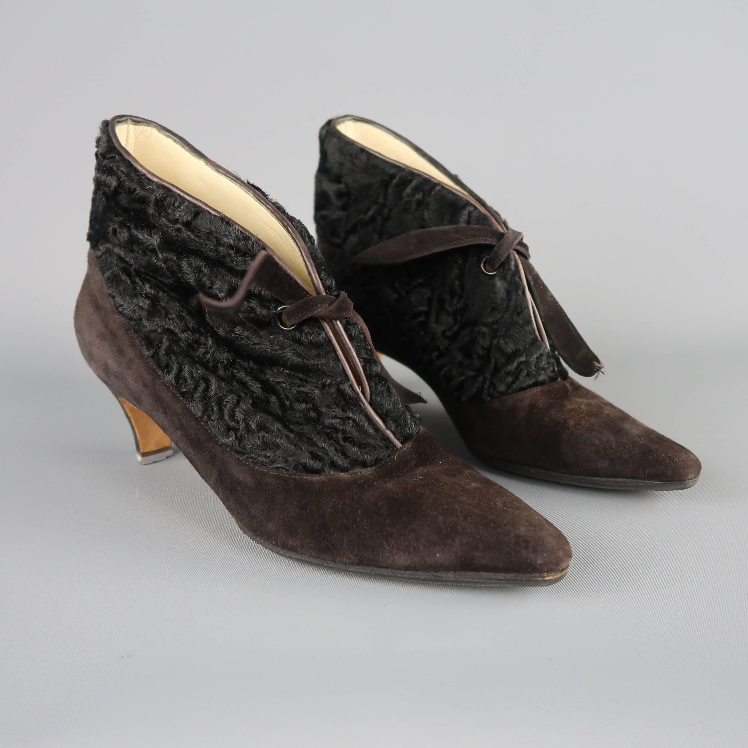 Vintage Manolo Blahnik booties come in brown suede with  a pointed toe, covered kitten heel, toed front, and black Karakul Lamb fur panel. Wear throughout. As-is. Made in Italy.
 
Fair Pre-Owned Condition.
Marked: IT 37
 
Measurements:
 
Heel: 2 in.
