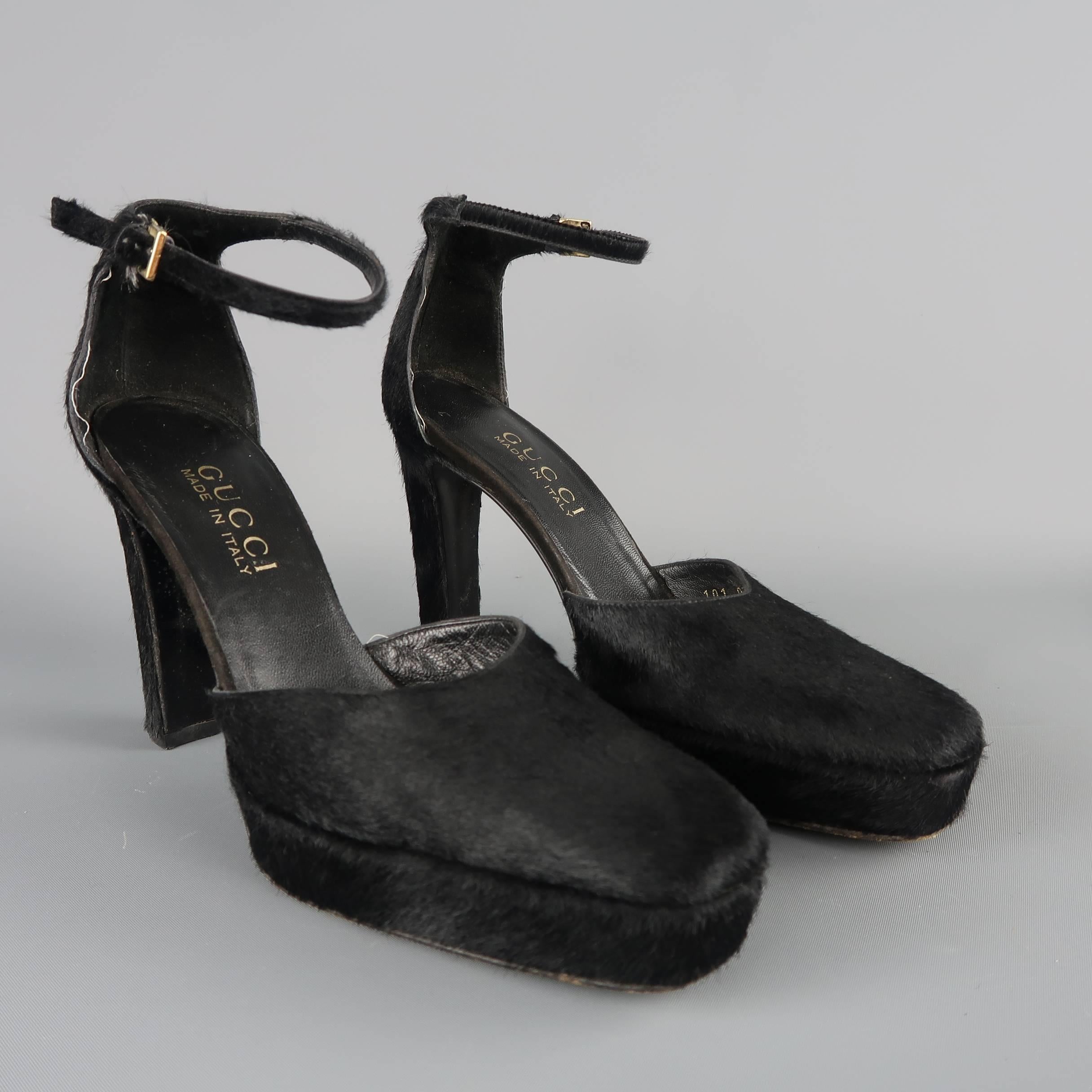 Gucci By Tom Ford pumps come in black pony hair with a squared pointed toe,  platform, thick covered stiletto heel, and ankle strap. Made in Italy.
 
Good Pre-Owned Condition.
Marked: IT 35.5 B
 
Measurements:
 
Heel: 4 in.
Platform: 1 in.
