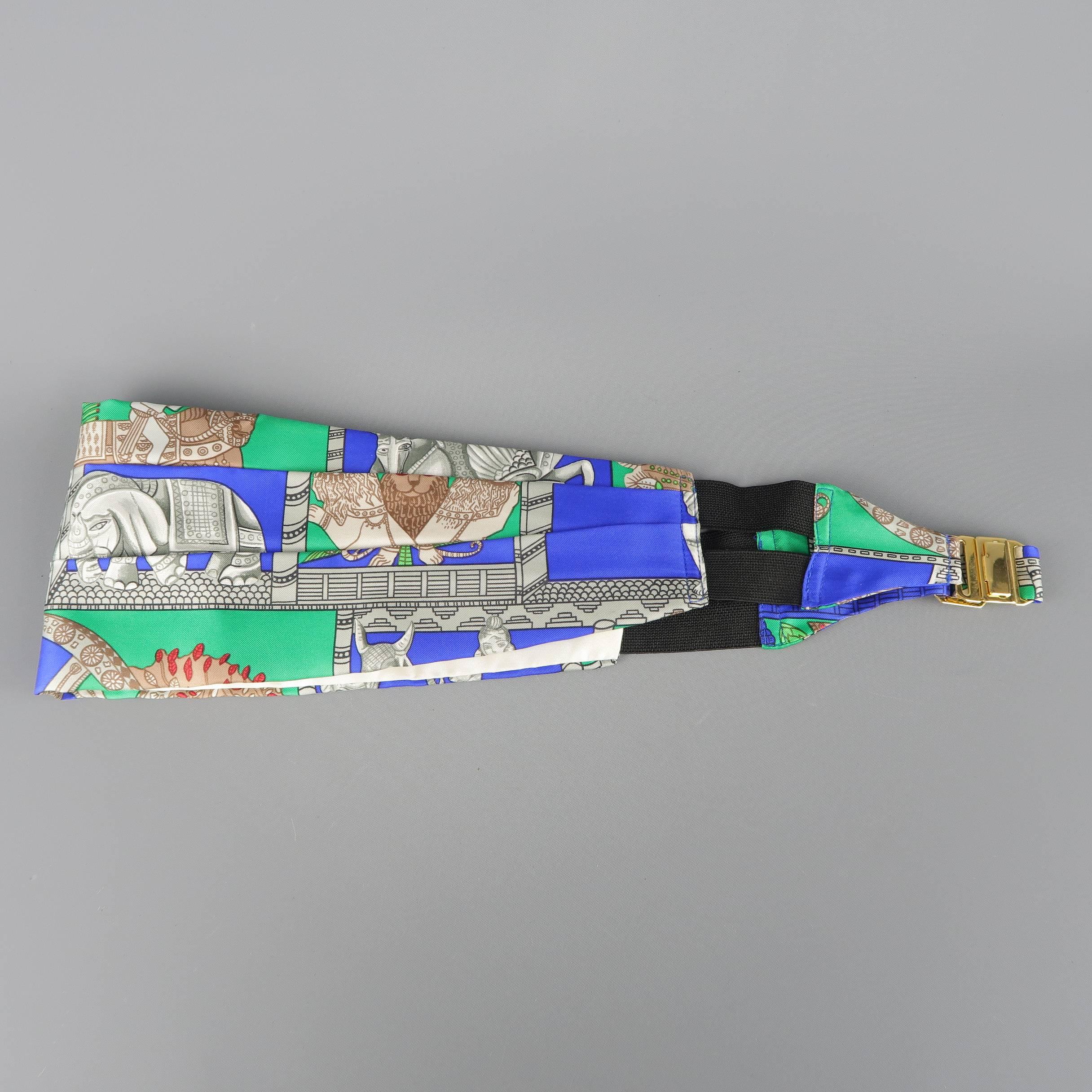 Vintage HERMES pleated cummerbund  comes in green silk twill with all over blue, gray, and taupe Indian Torana print depicting elephant and lion statues. With box. Made in France.
 
Excellent Pre-Owned Condition.
Marked: FR 42
 
Measurements:
