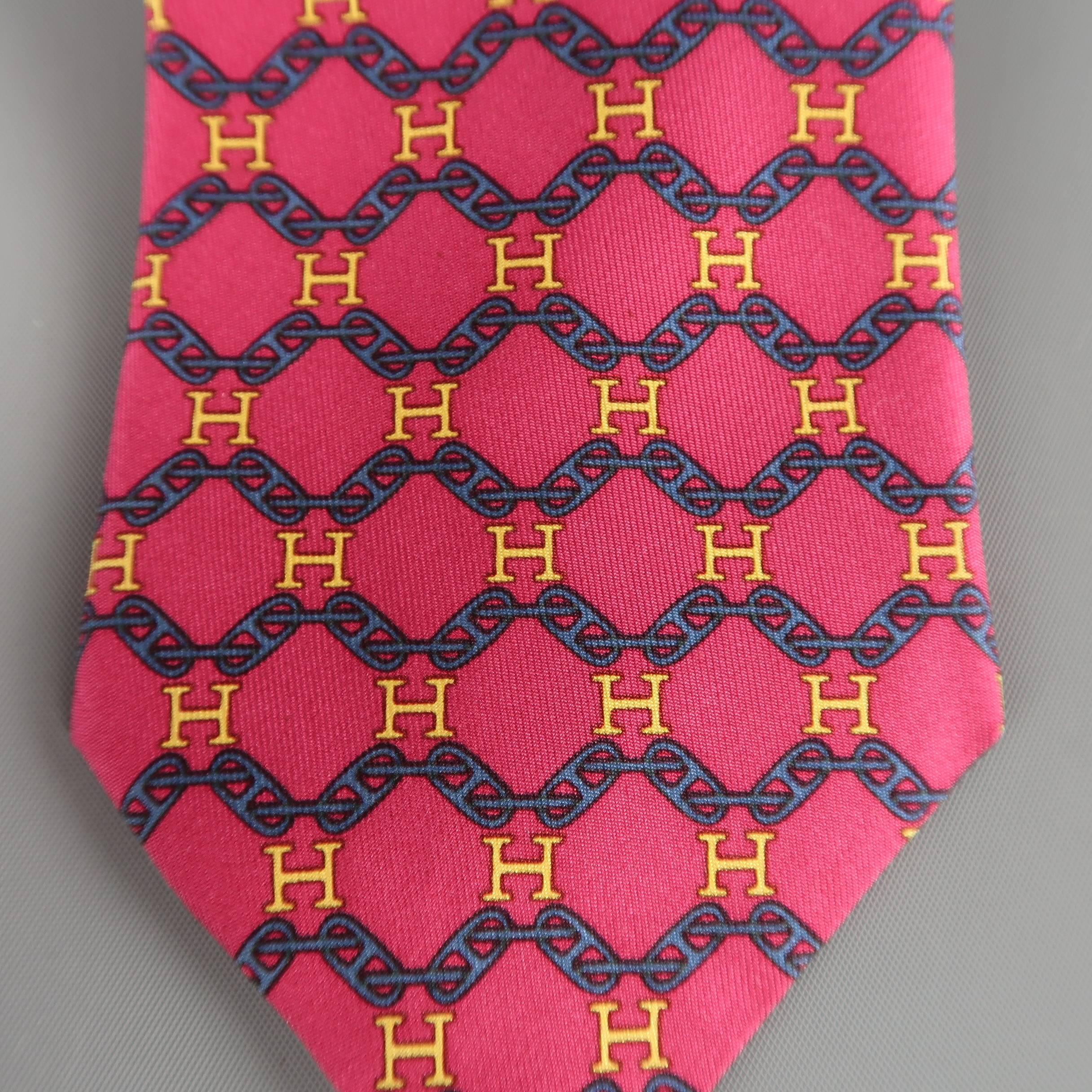 Vintage HERMES necktie comes in raspberry red silk twill with all over navy chain and yellow H print. Stains throughout. As-is. Made in France.
 
Fair Pre-Owned Condition.
 
Width: 3.25 in.
