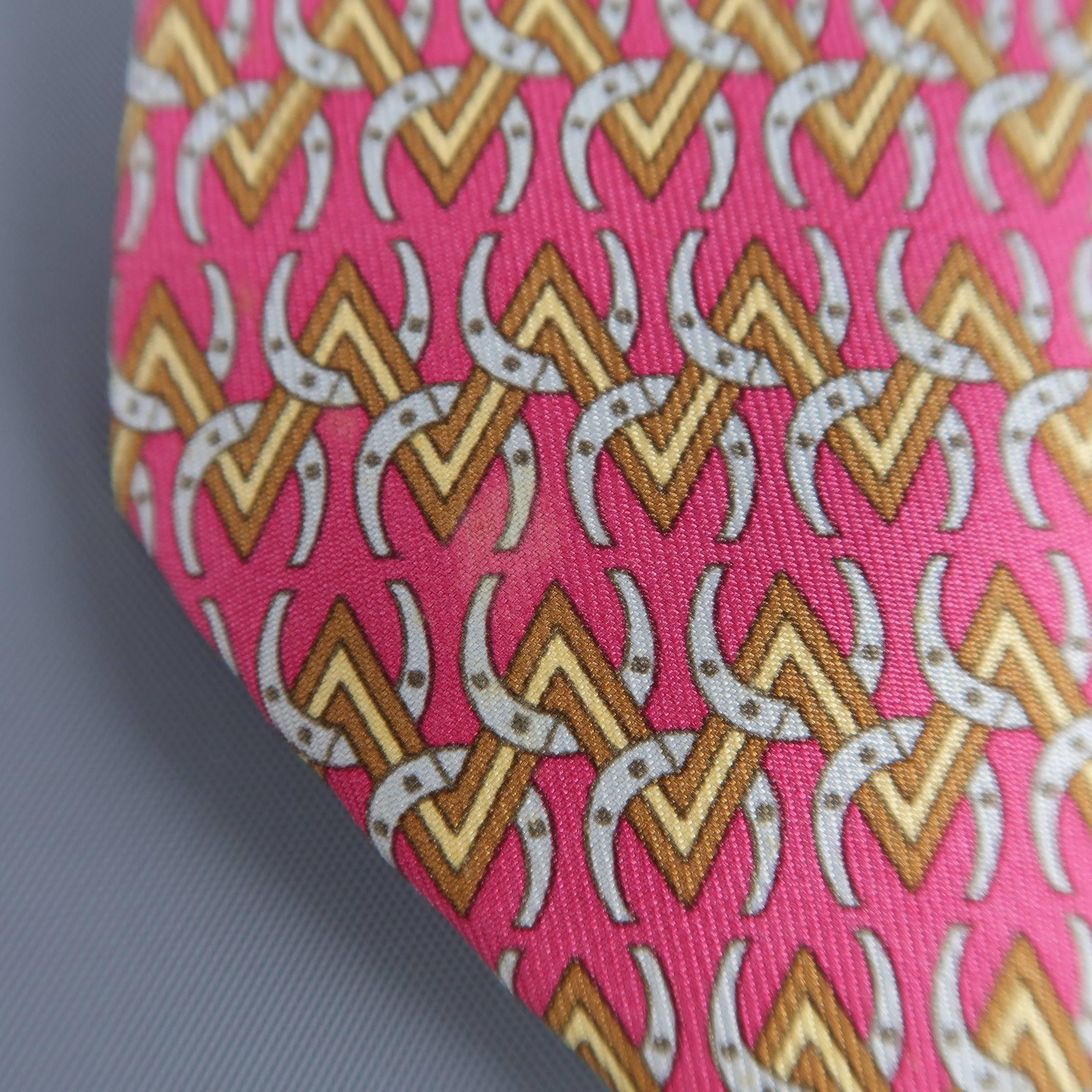 Vintage HERMES necktie comes in raspberry red silk twill with all over Gold chevron with grey horseshoes print. Stains on front. As-is. Made in France.
 
Fair Pre-Owned Condition.
 
Width: 3.25 in.
