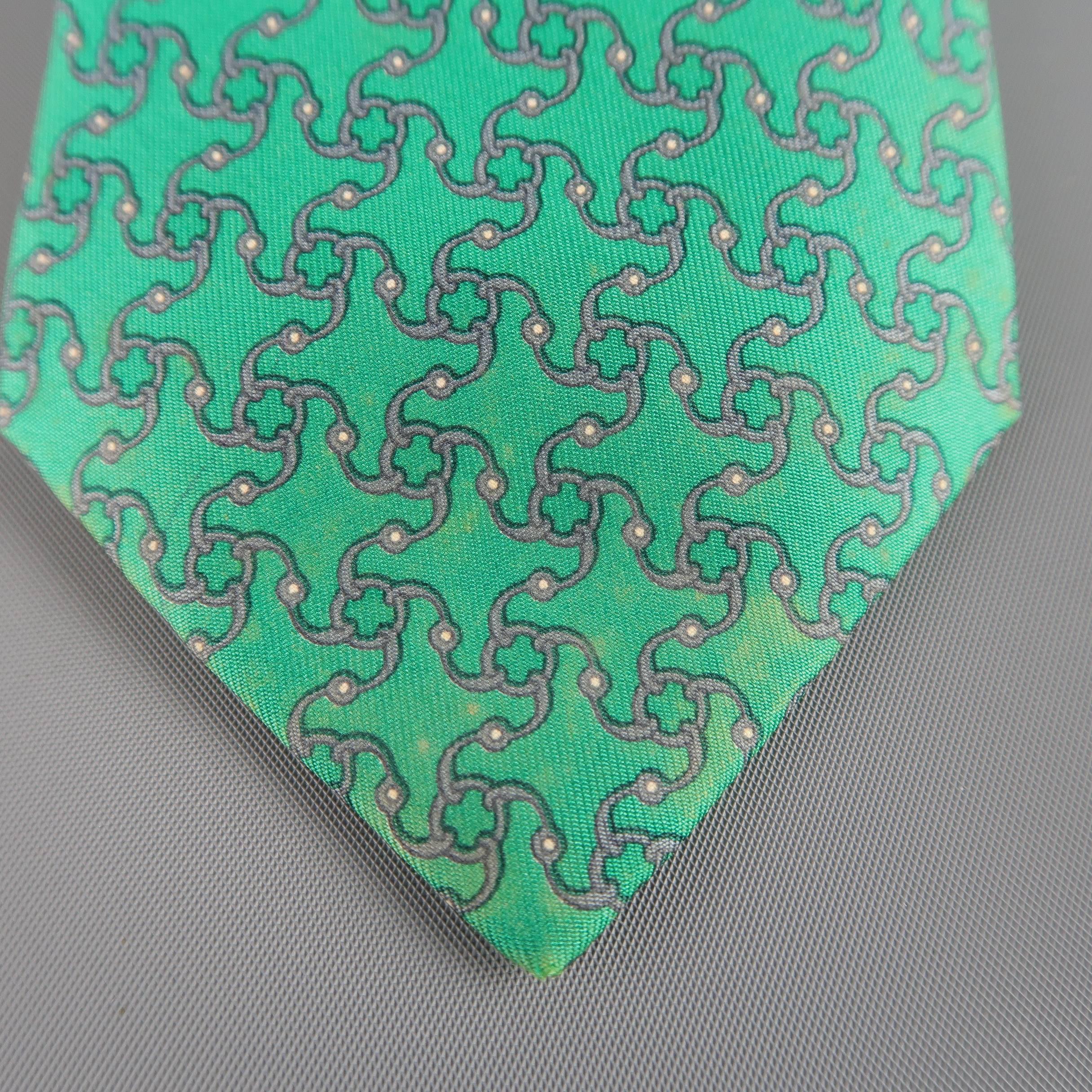 Vintage HERMES necktie comes in emerald green silk twill with all over gray interlock pattern. Discolorations throughout. As-is. Made in France.
 
Fair Pre-Owned Condition.
 
Width: 3.25 in.
