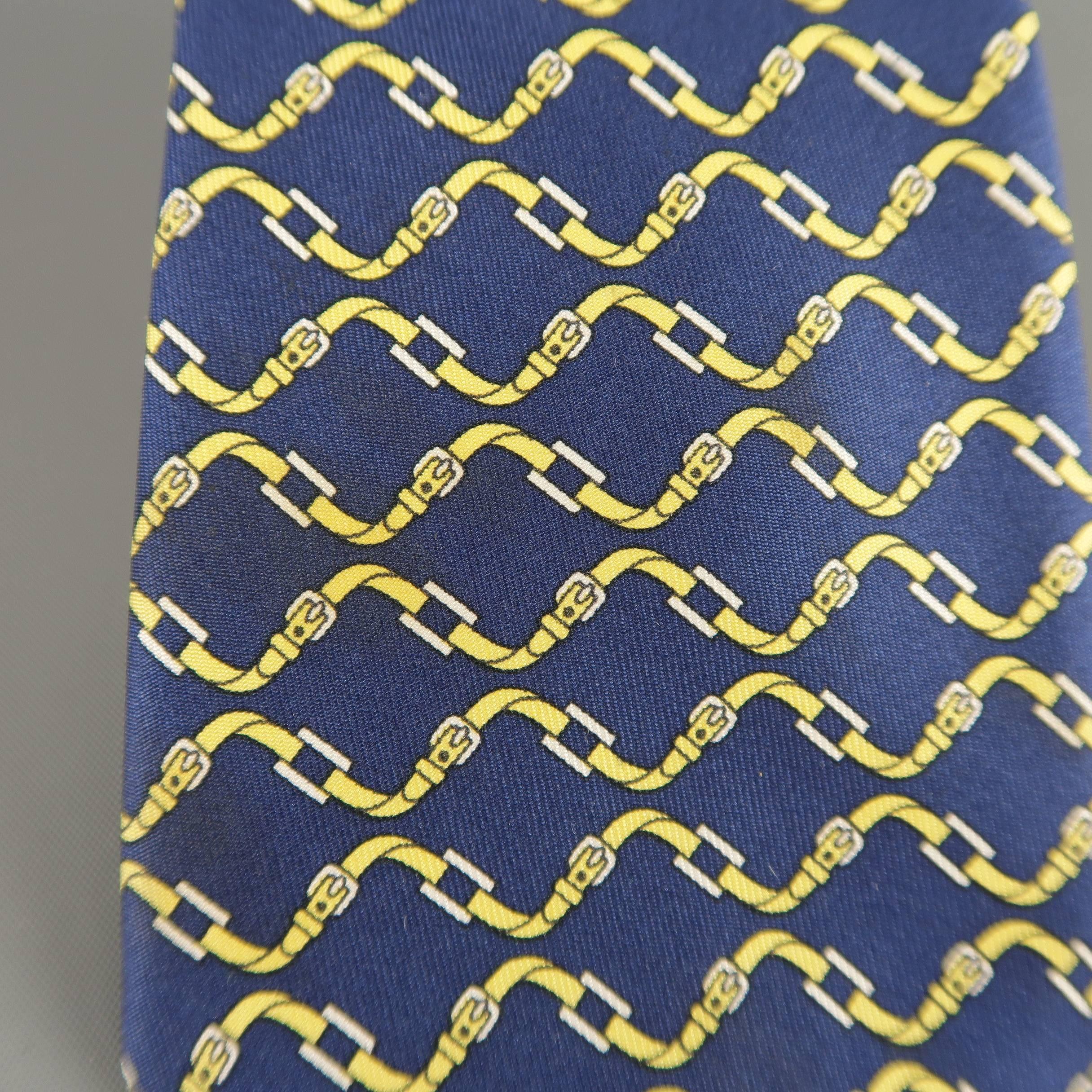 Vintage HERMES necktie comes in navy silk twill with all over yellow belt print. Wear throughout. As-is. Made in France.
 
Fair Pre-Owned Condition.
 
Width: 3.25 in.
