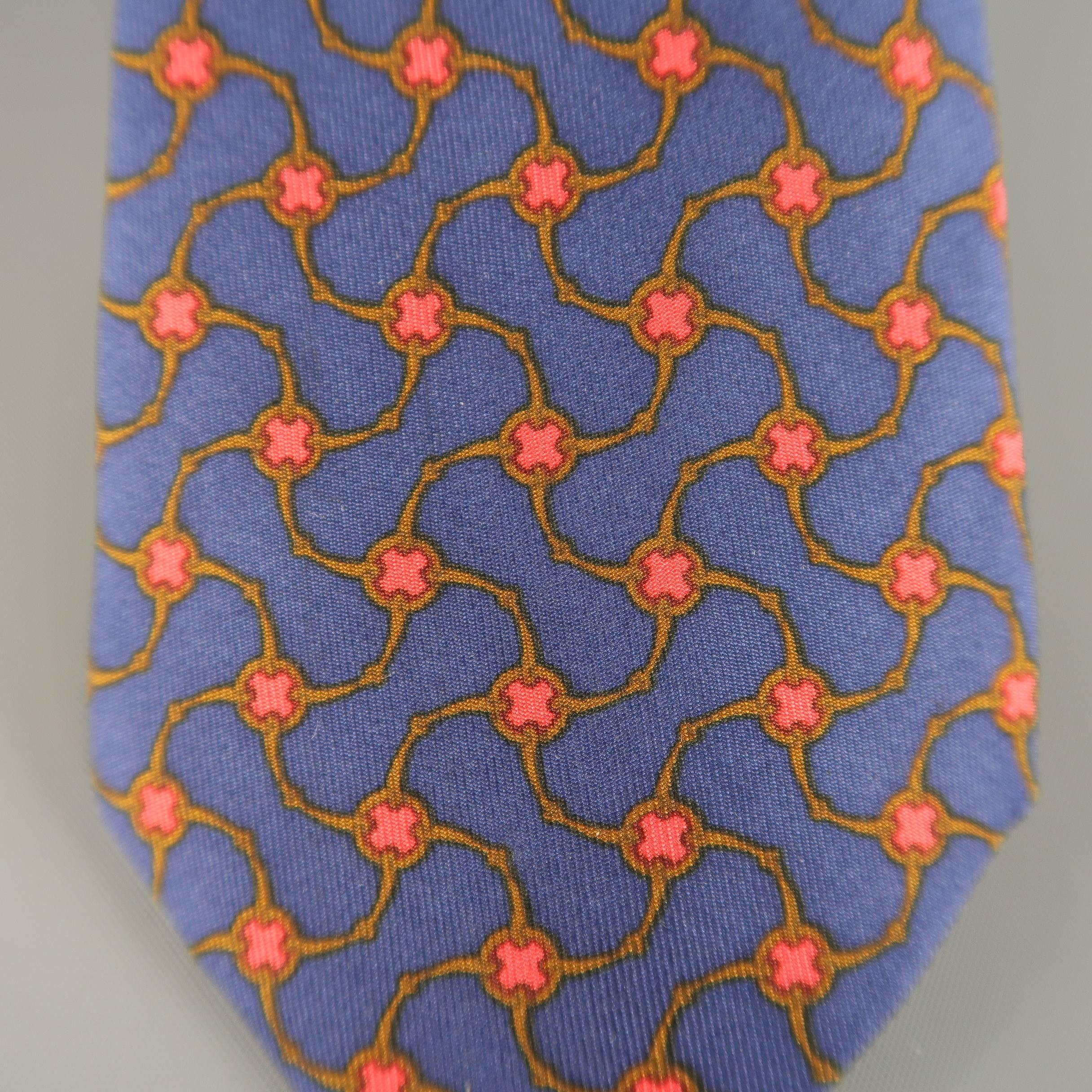 Vintage HERMES necktie comes in navy blue silk twill with all over red and brown interlock print. Made in France.
 
Good Pre-Owned Condition.
 
Width: 3 in.
